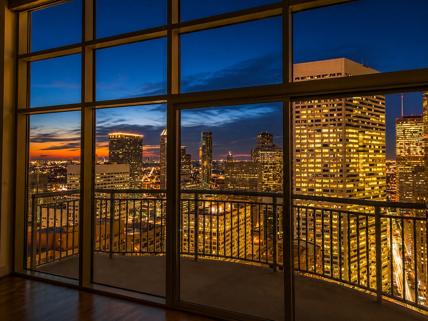 A showstopping skyline view becomes even more spectacular after sunset, with glittering city lights framed by dramatic floor-to-ceiling windows. This breathtaking urban backdrop delivers the sophisticated high-rise lifestyle buyers dream about.