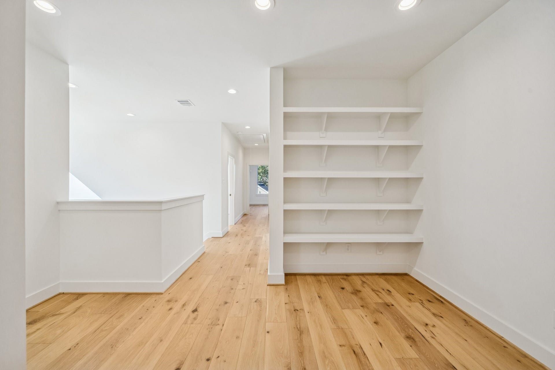 Looking back towards the hallway from the reading nook and gameroom area.