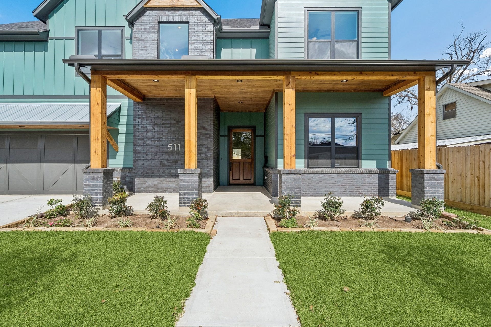 Huge covered porch gives you lots of space to hang out and greet the neighbors. A couple of rocking chairs would be perfect.