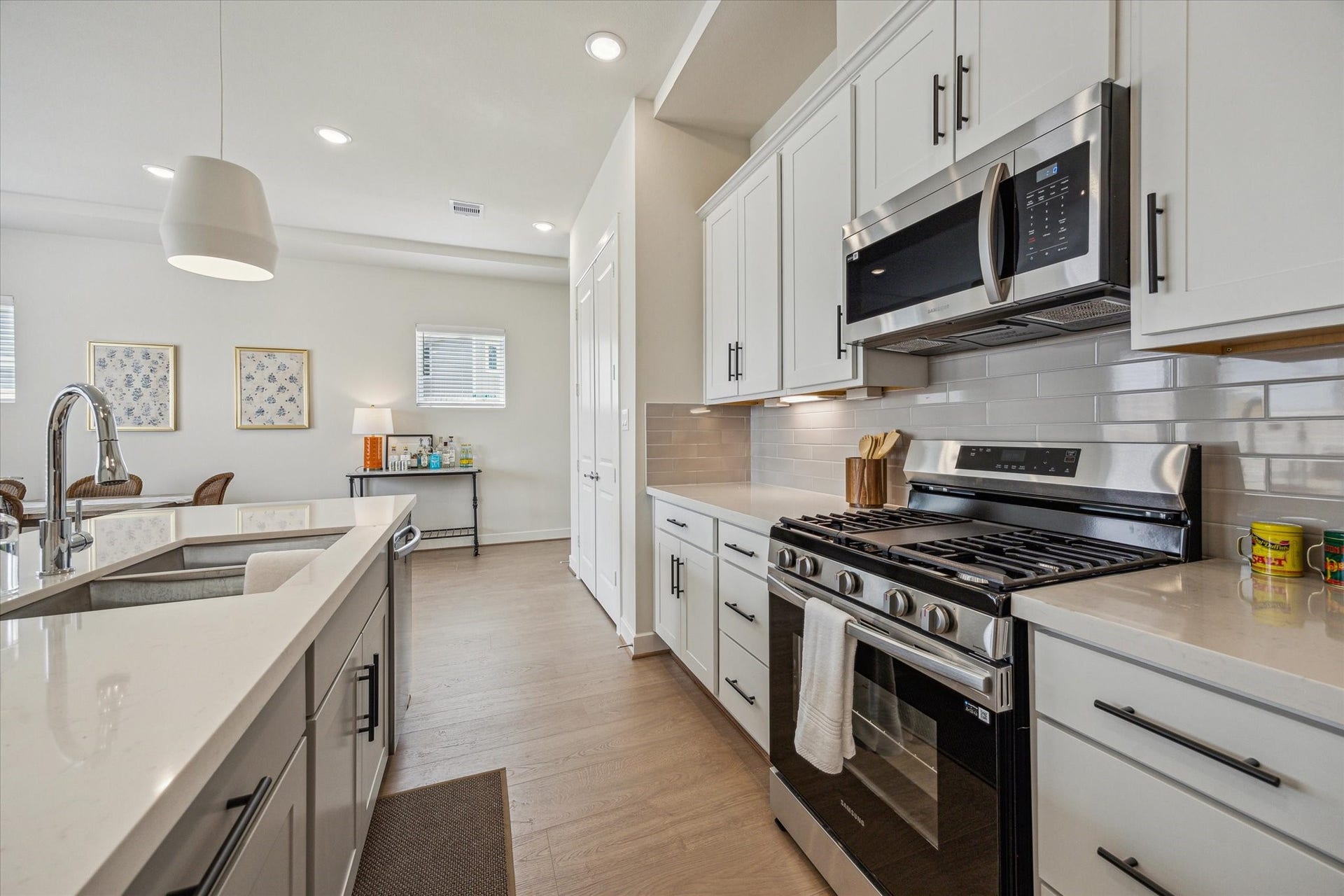 24405 Colonial Mound Drive, Katy, TX 77493 Representative photo showing the communitys model home kitchen. Layout and selections may vary.