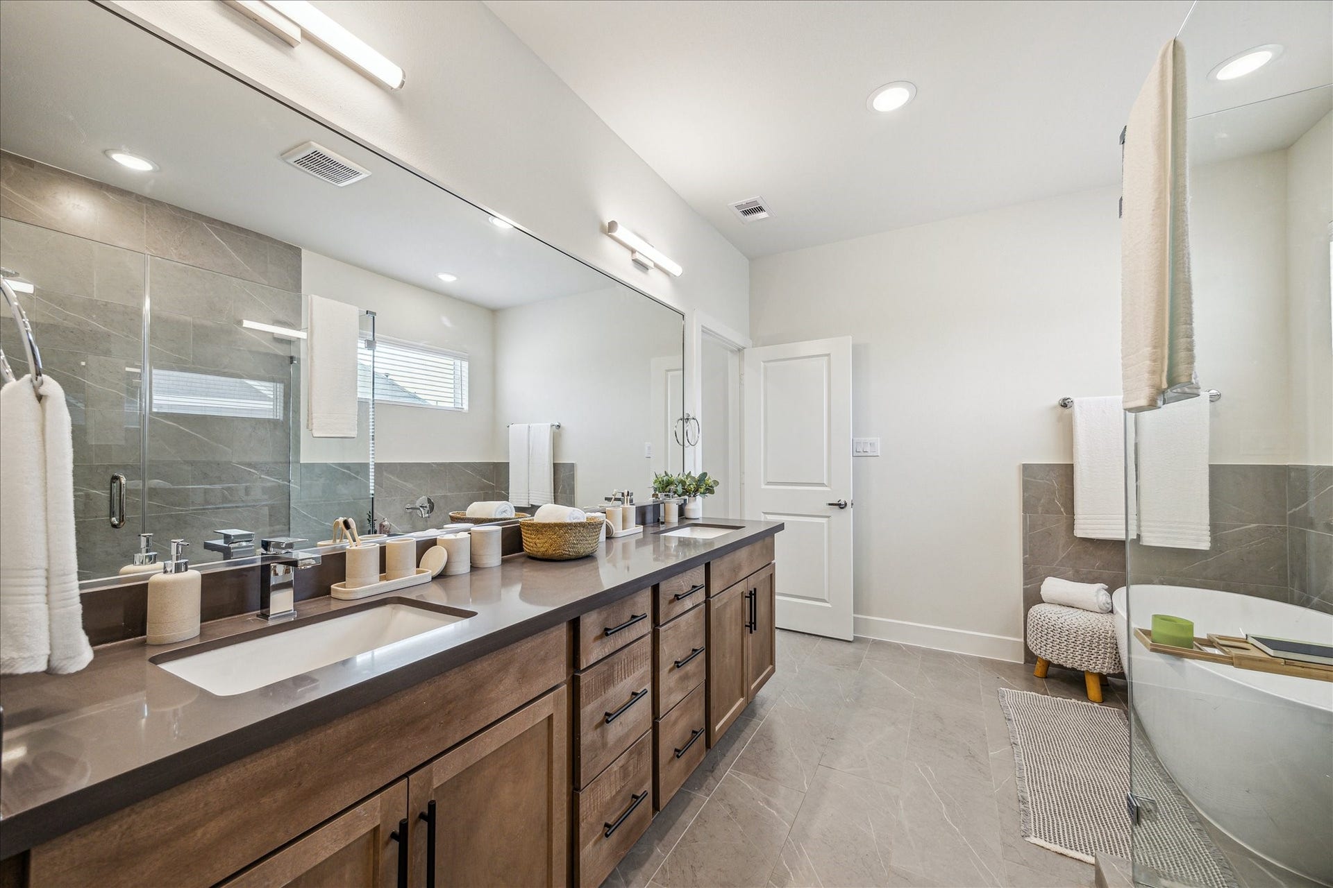24405 Colonial Mound Drive, Katy, TX 77493 Representative photo showing the communitys model home primary bathroom. Layout and selections may vary.