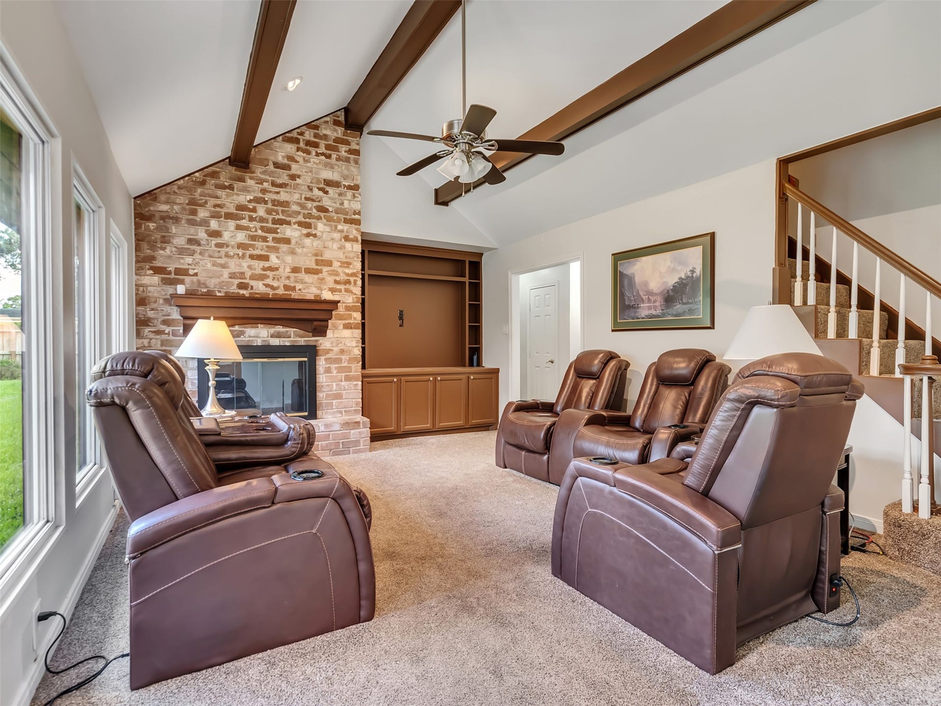 3017 Inwood Drive, Dickinson, TX 77539 Cozy nights start here. This inviting living room features a beautiful brick fireplace that adds warmth, charm, and the perfect focal point for gathering with family and friends.