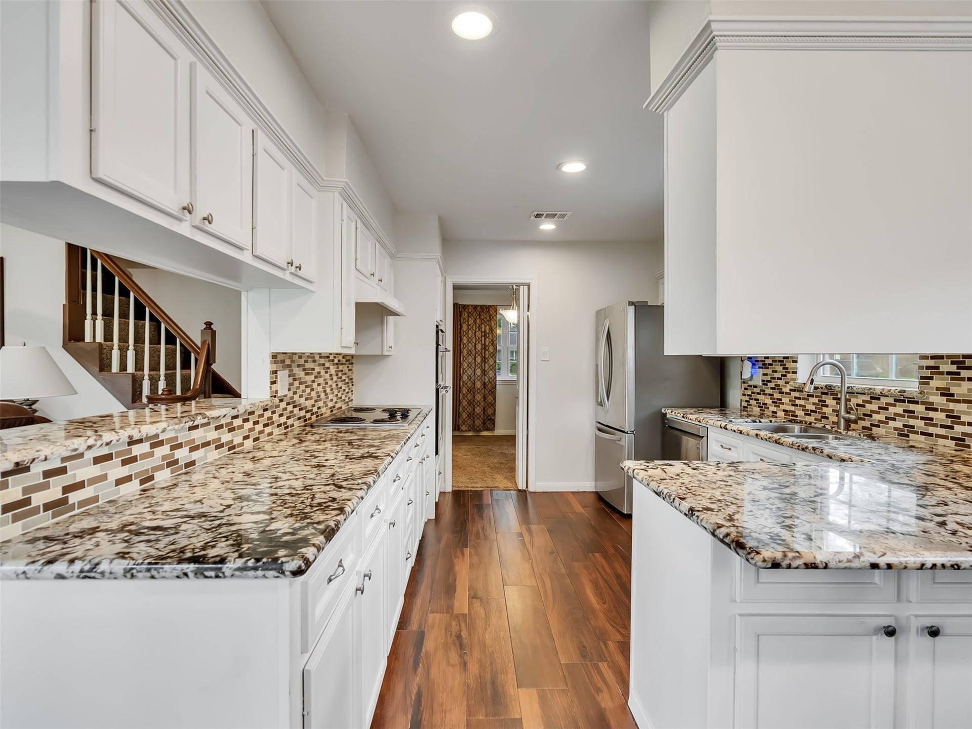 3017 Inwood Drive, Dickinson, TX 77539 This open-concept kitchen flows seamlessly into the living area, creating the perfect space for entertaining, gathering, and everyday connection.