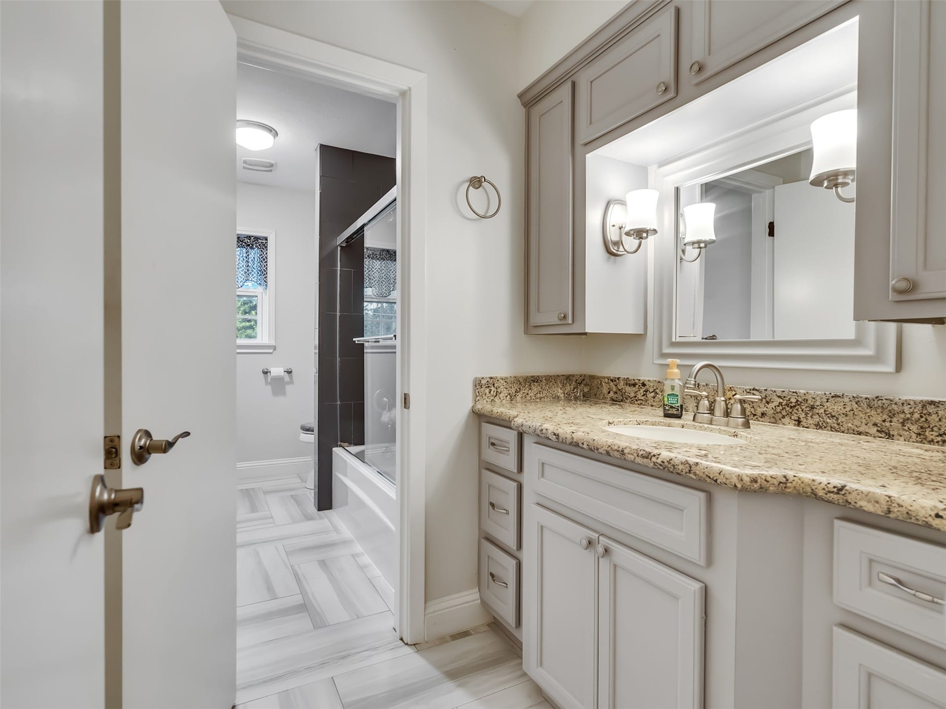 3017 Inwood Drive, Dickinson, TX 77539 Upstairs bathroom has functionality and style.