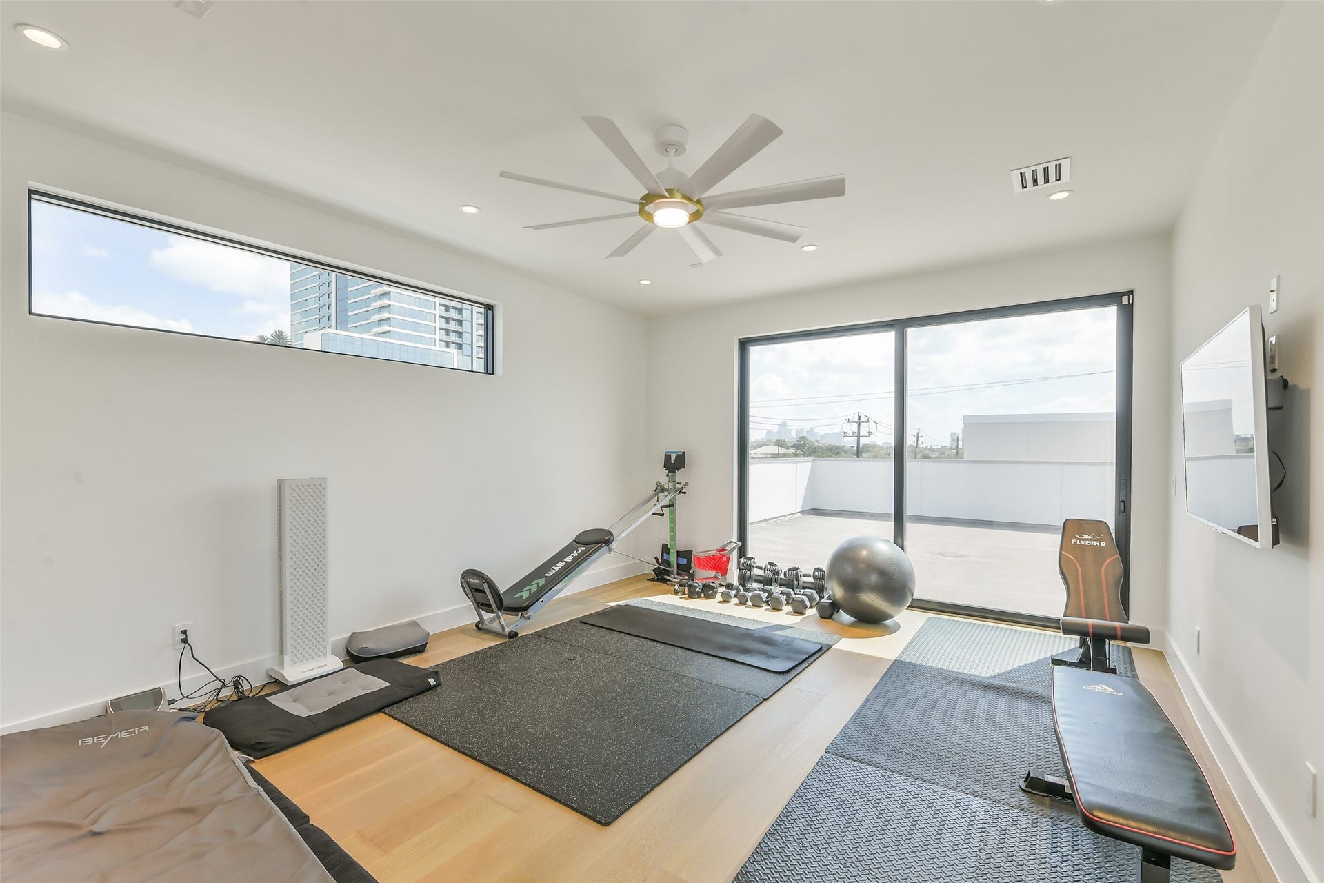 3003 Virginia Street, Houston, TX 77098 Third floor bedroom used as a gym with enstuie bathroom