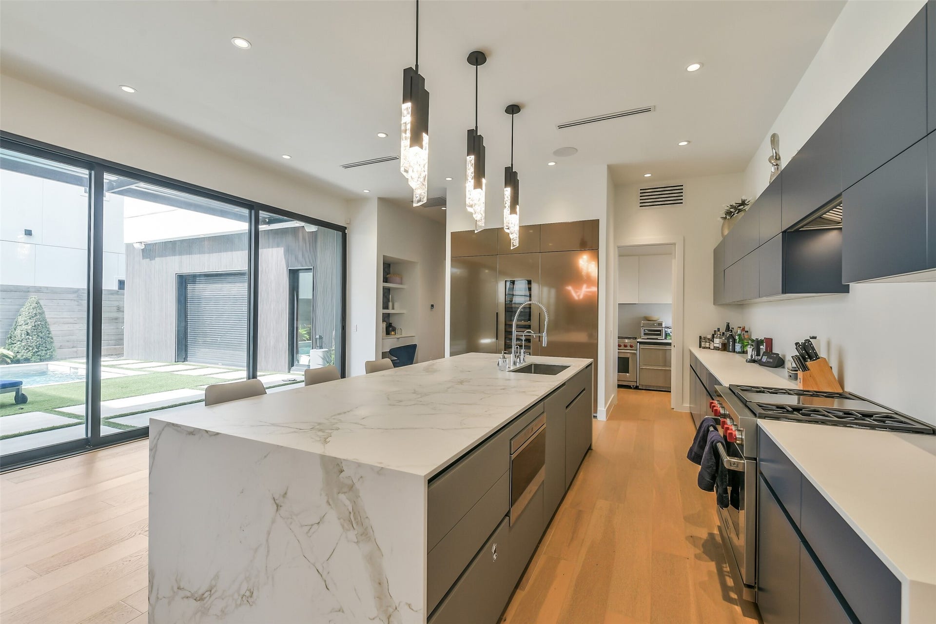 3003 Virginia Street, Houston, TX 77098 Wonderful open kitchen with large island overlooking pool.
