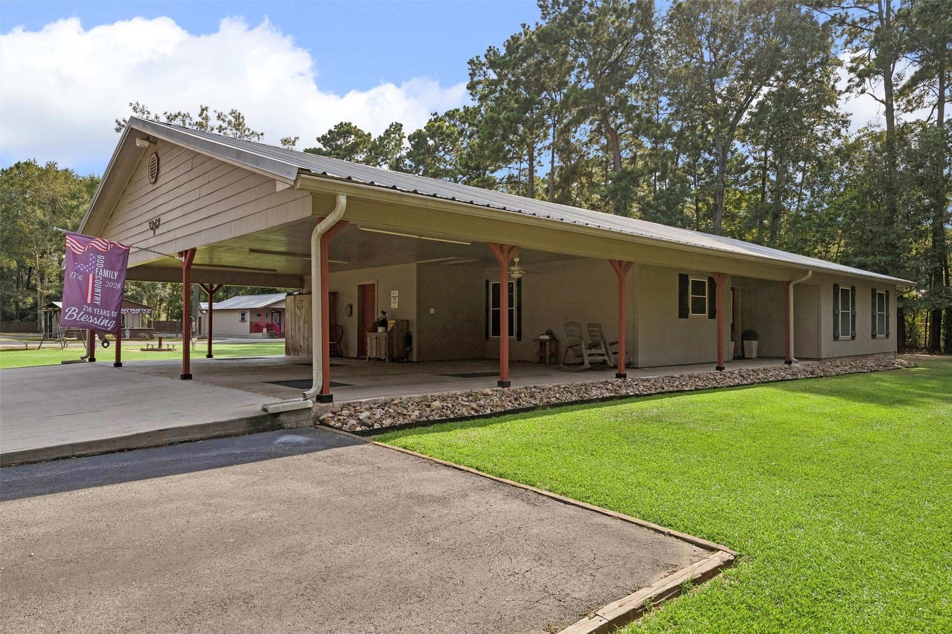 The Main Home with 3 car carport. Flooring has stamped concrete