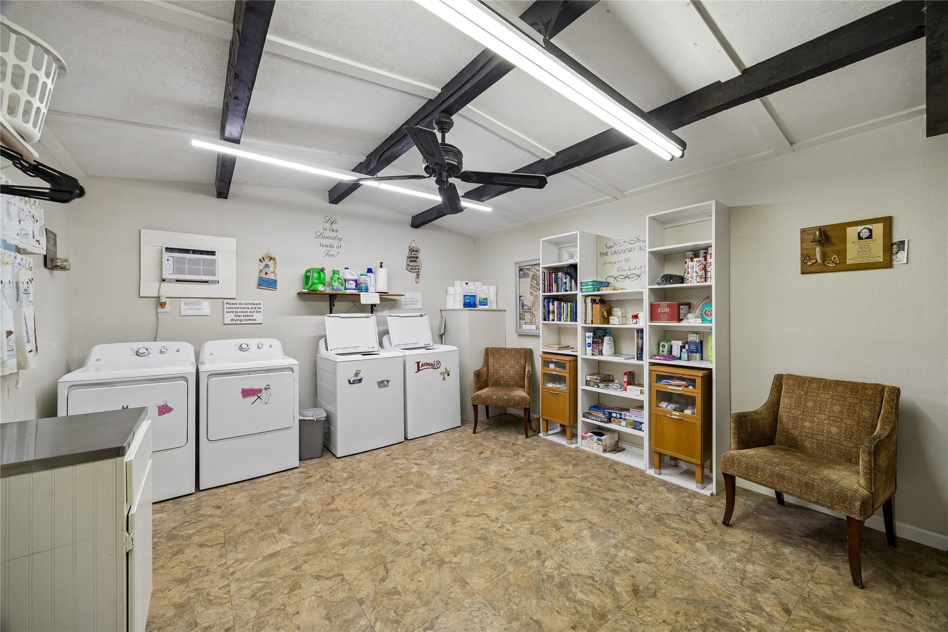 Laundry room includes double washers and dryers