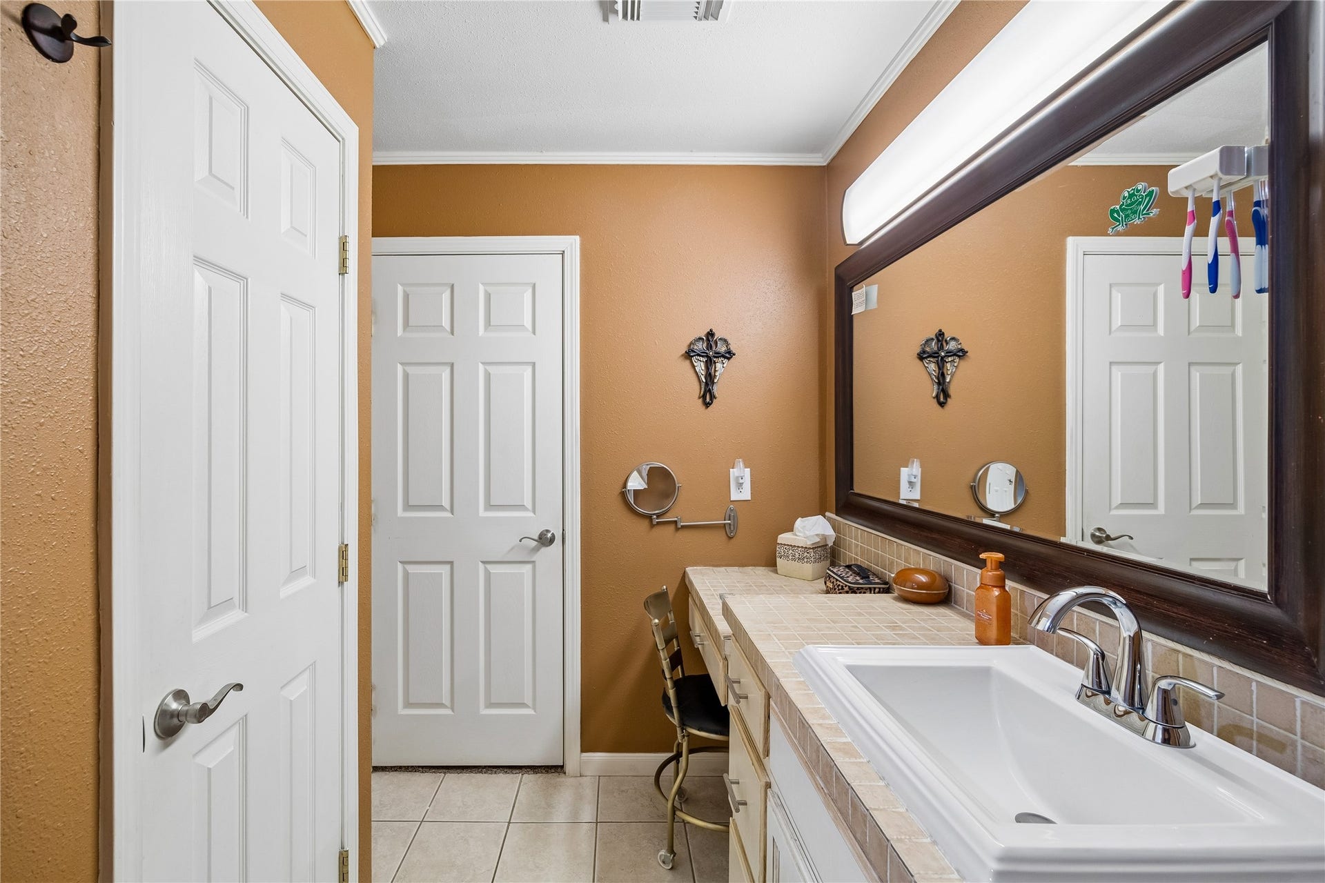 the primary ensuite boasts 4' shower, an elegant sit-down makeup vanity and an expansive walk-in closet
