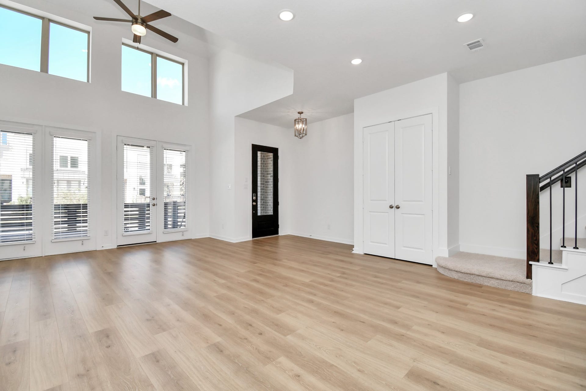 16506 Texas Hill Country Rd, Cypress, TX 77433 The living room is bright and spacious, featuring soaring high ceilings that amplify natural light for an open, airy feel.