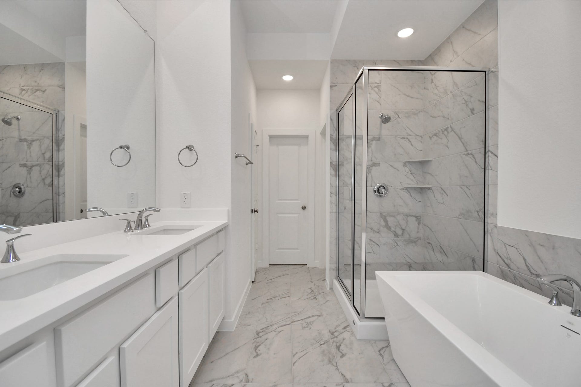 16506 Texas Hill Country Rd, Cypress, TX 77433 The spacious primary bathroom features a stand-up shower and a soaking tub, creating a perfect oasis for relaxation and rejuvenation.