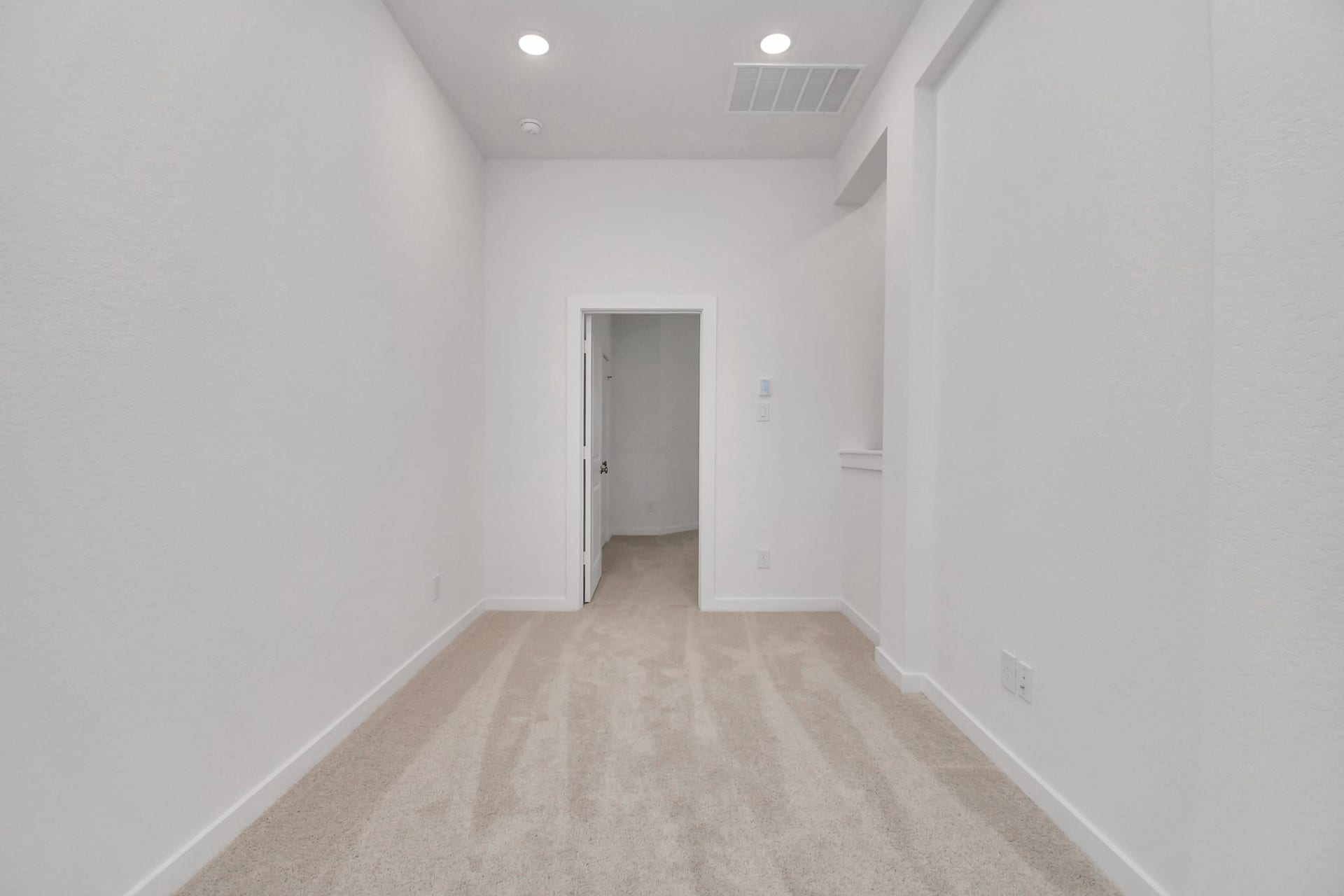 16506 Texas Hill Country Rd, Cypress, TX 77433 The large upstairs hallway provides ample space and natural light, creating a welcoming transition between rooms.