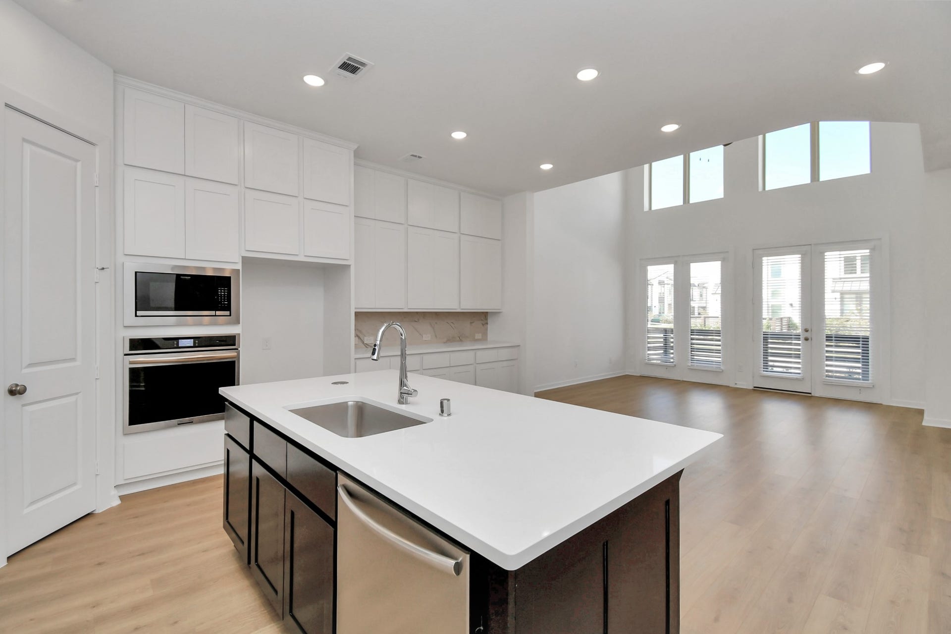 16506 Texas Hill Country Rd, Cypress, TX 77433 The open kitchen is perfect for entertaining, featuring a seamless flow into the living area for easy socializing and gatherings.
