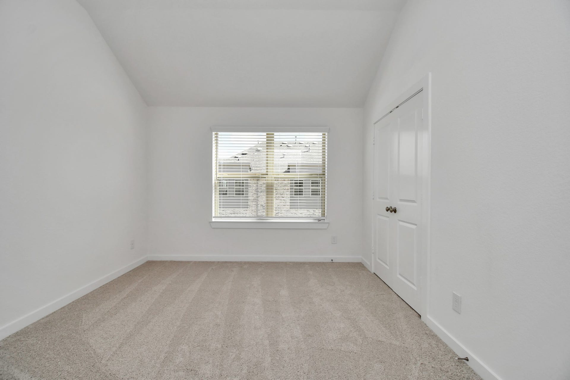 16506 Texas Hill Country Rd, Cypress, TX 77433 The secondary bedroom features a bright white palette and soft carpet, creating a cozy and inviting atmosphere.