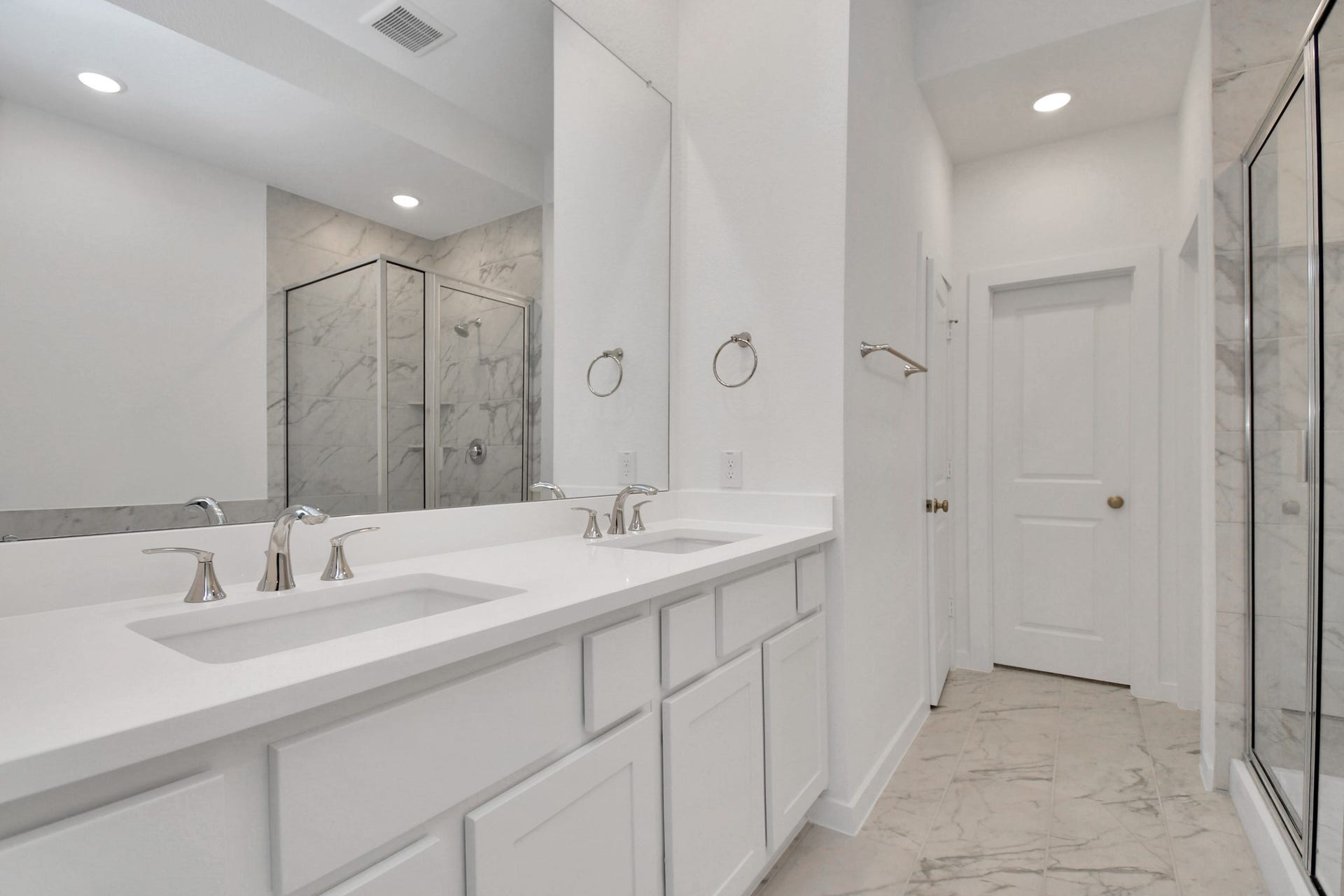 16506 Texas Hill Country Rd, Cypress, TX 77433 The primary bathroom features double sinks, providing ample space and convenience for a stylish and functional retreat.