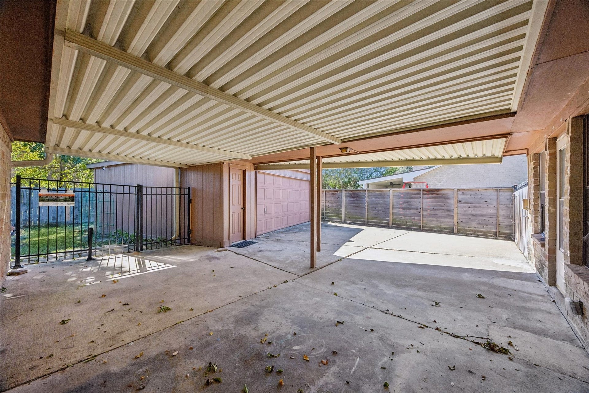 10110 Sagemill Drive, Houston, TX 77089 Spacious covered patio with sturdy metal roofing.