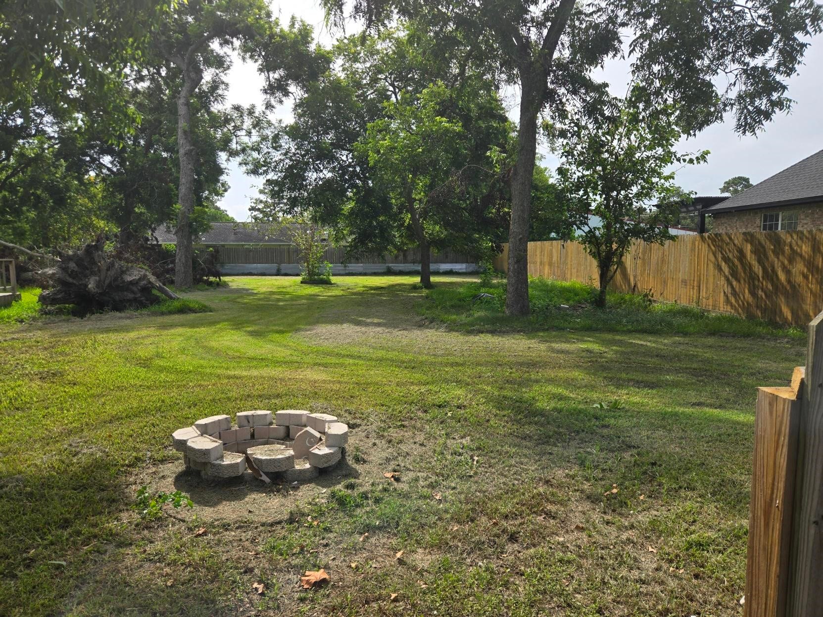 14306 4th Street, Santa Fe, TX 77517 Backyard with fire pit
