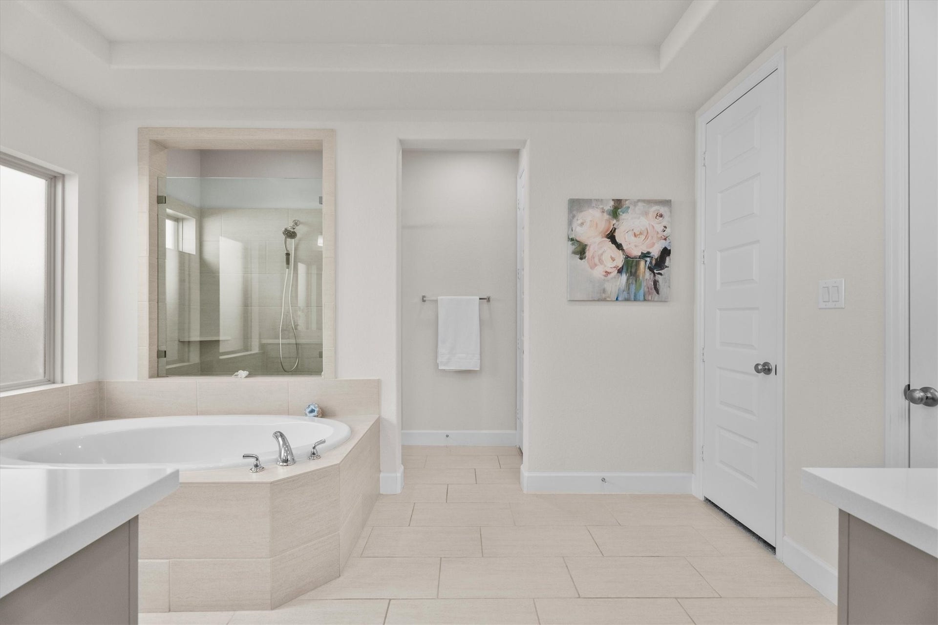 Start and end each day in a spa-inspired ensuite featuring a soaking tub, oversized shower, dual vanities, and two closets.