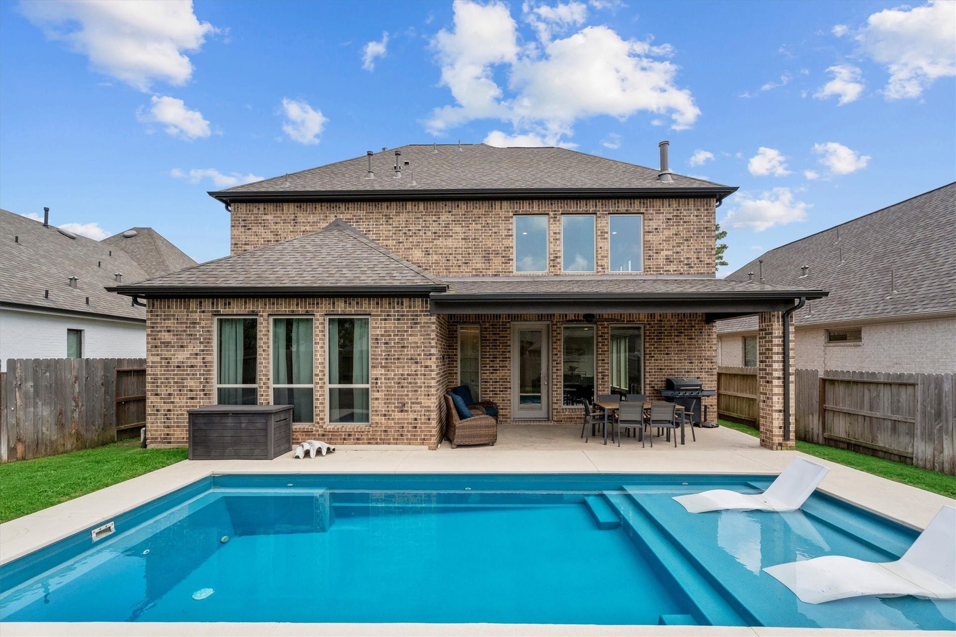 Resort-style living starts right here with a sparkling saltwater pool, covered outdoor living, and room to relax all season long.