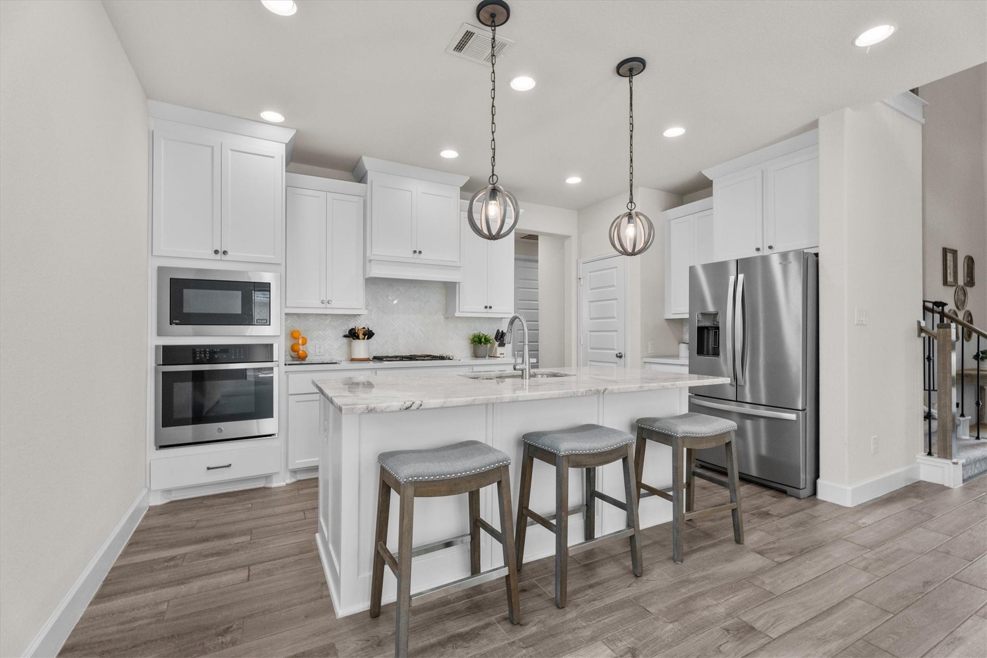 Gather around the kitchen where conversations, celebrations, and everyday moments naturally come together.