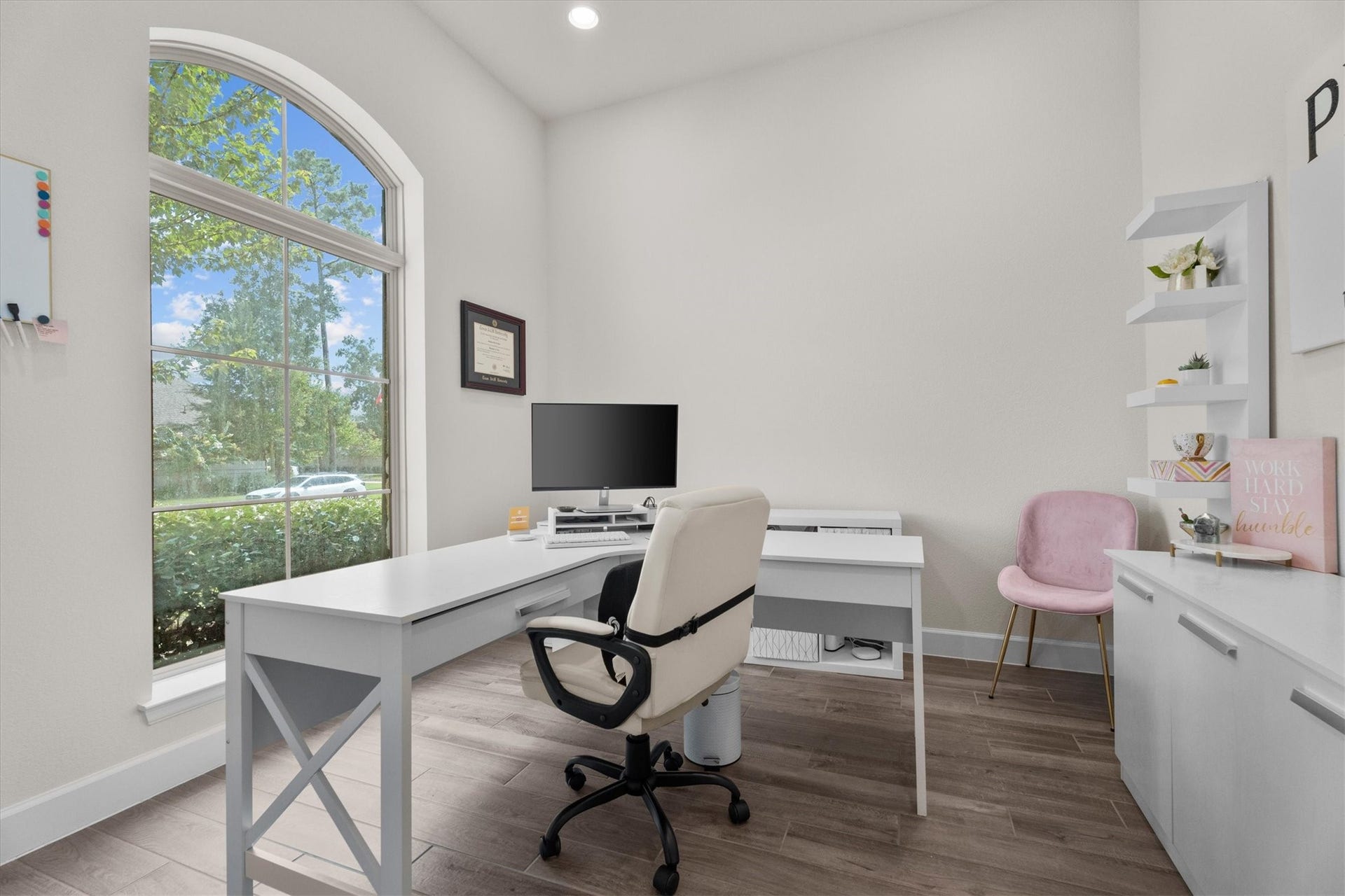 French doors create the perfect private workspace, while front-facing windows fill the room with natural light.