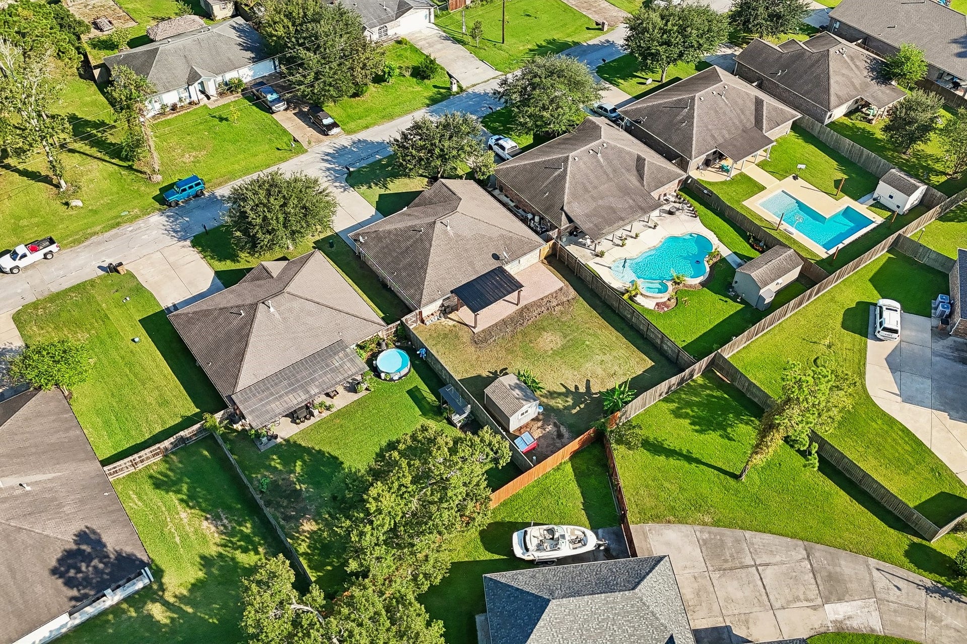 5012 Bayou Dr, Dickinson, TX 77539 Charming neighborhood with spacious backyards and private pools, offering a perfect blend of relaxation and community living.