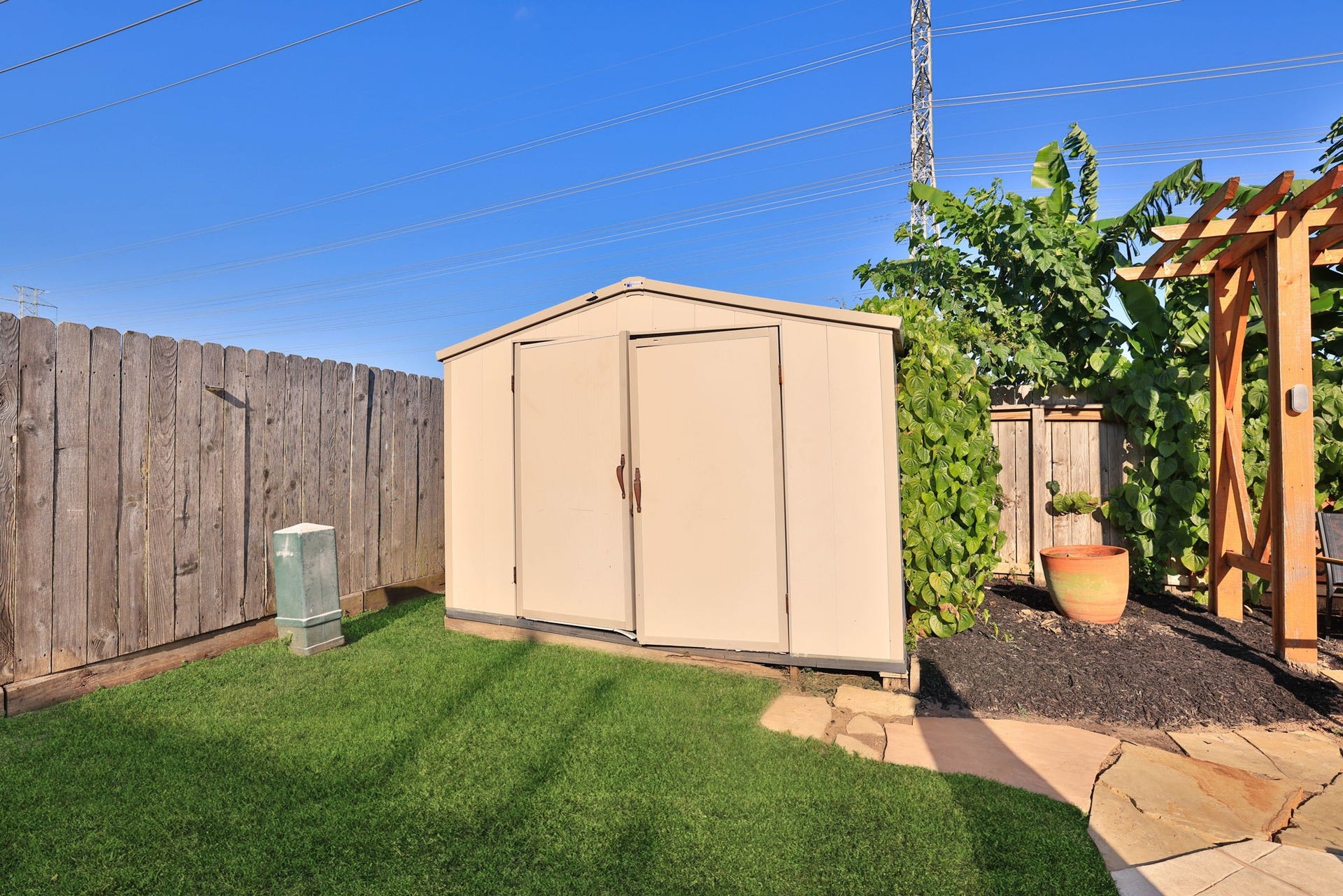 236 Sunset Ridge Drive, League City, TX 77573 Convenient backyard storage shed provides additional space for pool equipment, lawn care essentials, and outdoor accessories.