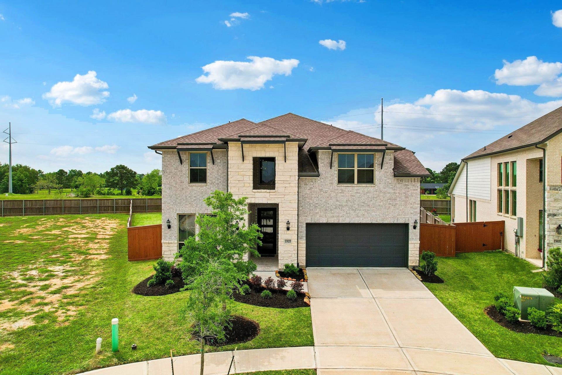 13525 Seneca Lake Drive, Texas City, TX 77568 Well maintained landscaping, the brick and stone add to the curb appeal