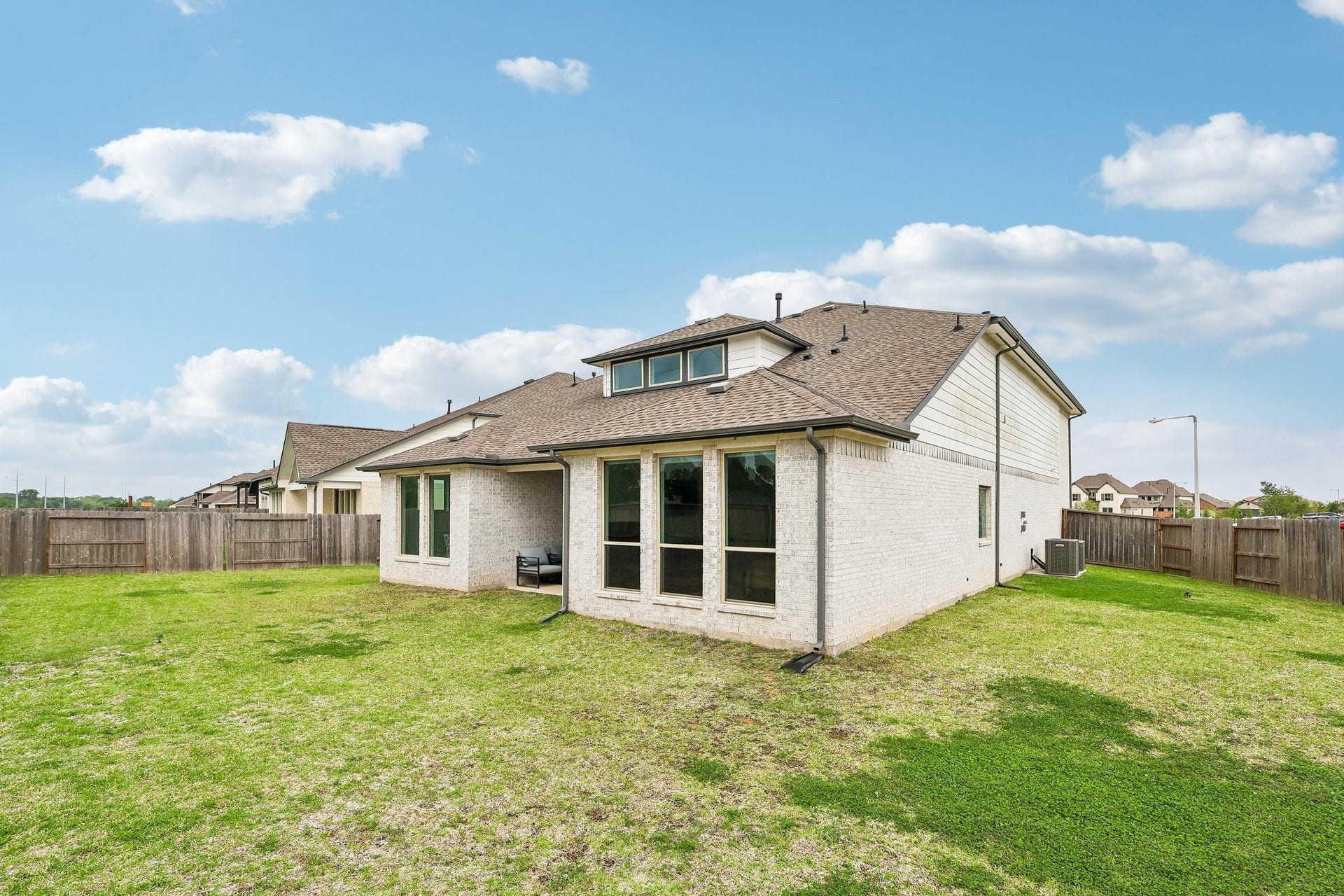 13525 Seneca Lake Drive, Texas City, TX 77568 The home features four sided brick
