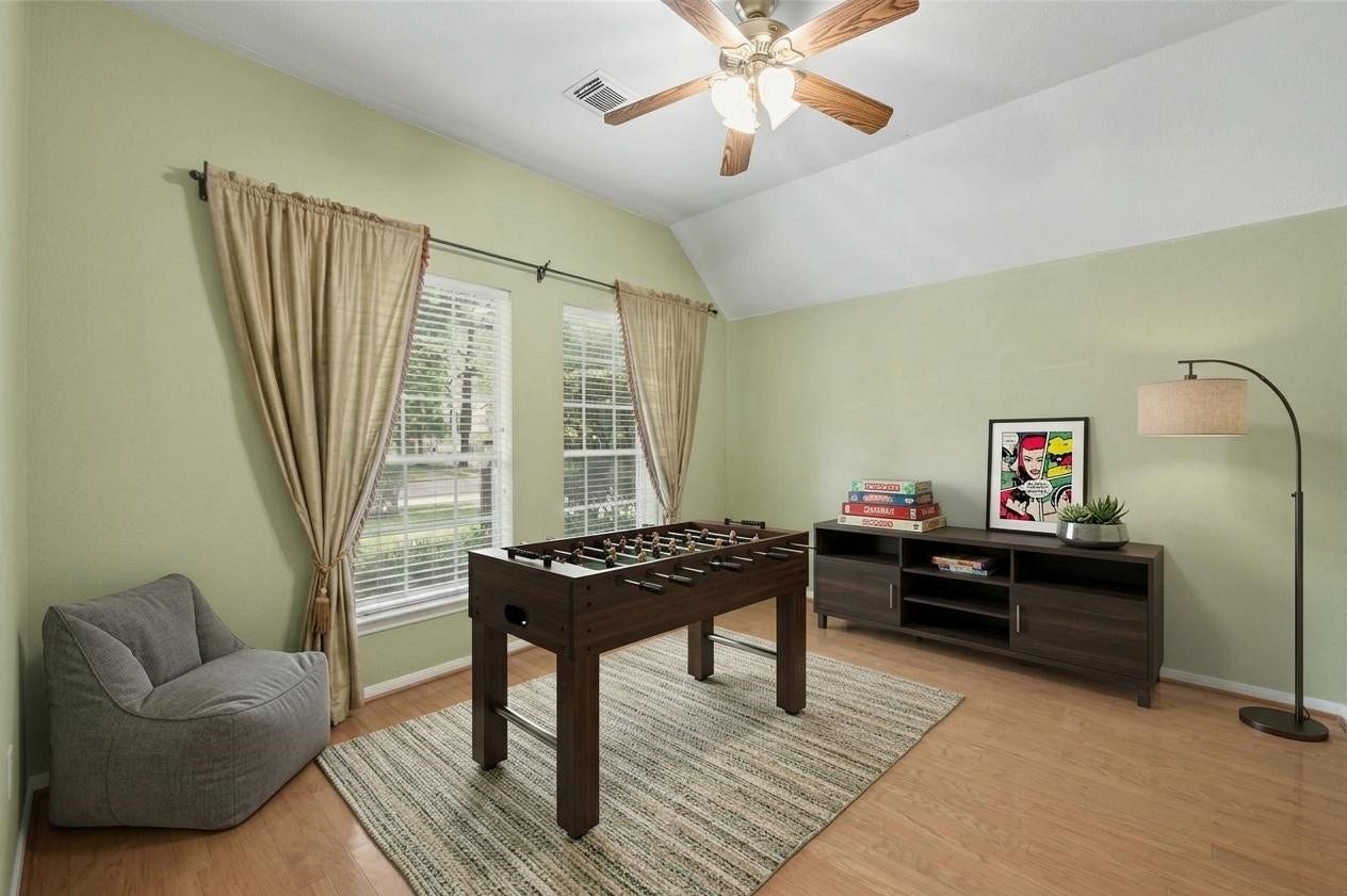 26 N Brooksedge Circle, The Woodlands, TX 77382 The versatile front room, virtually staged as a game room.