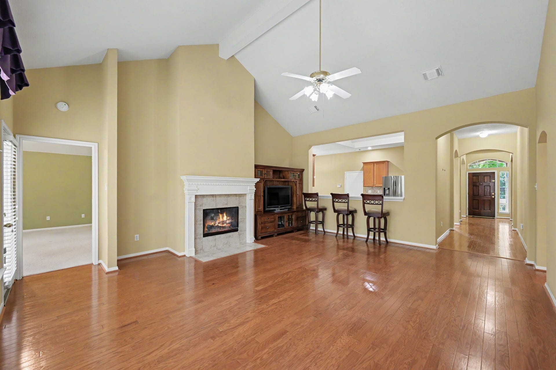 26 N Brooksedge Circle, The Woodlands, TX 77382 Alternate view of the main living space showing the pass-through window to the kitchen.