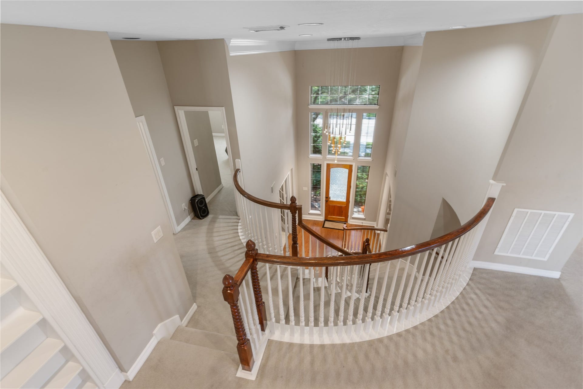 2525 W Ranch Drive, Friendswood, TX 77546 Beautiful view from the upstairs game room. The open design and high ceilings create a bright, spacious feel, showcasing the home's impressive architectural details and inviting layout.