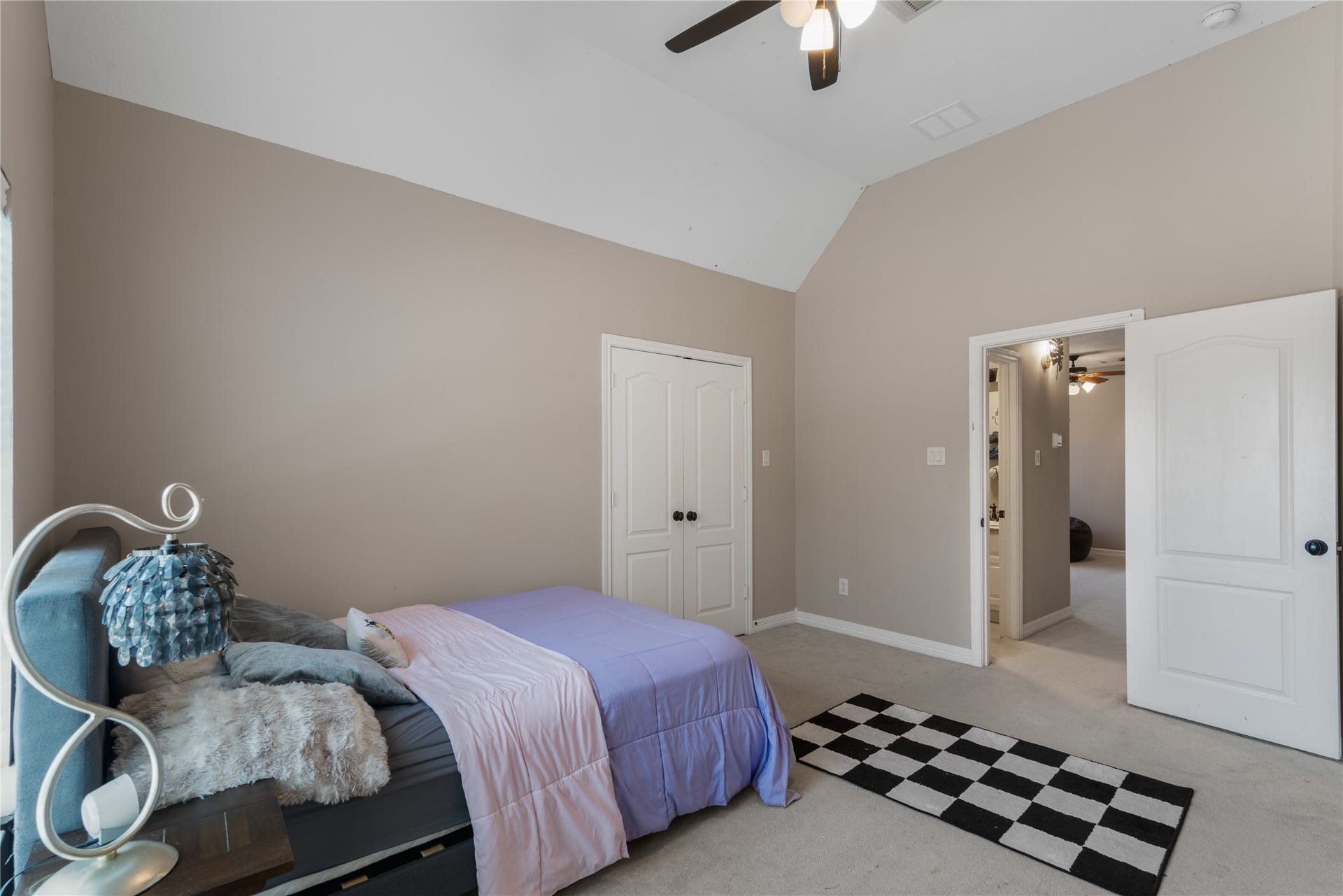 2525 W Ranch Drive, Friendswood, TX 77546 Bright secondary bedroom just off the upstairs game room offers plenty of natural light, making it a comfortable space for guests, children, or a home office.