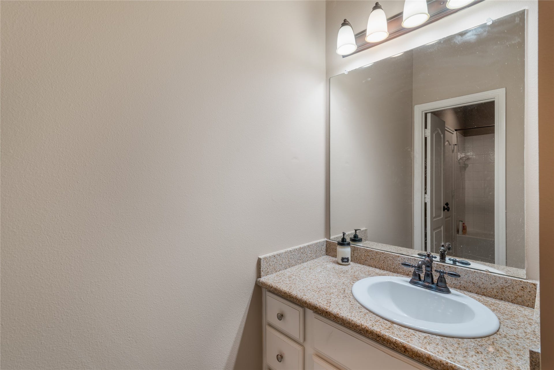 2525 W Ranch Drive, Friendswood, TX 77546 Convenient bathroom featuring a shared layout with separate vanity areas for added privacy.