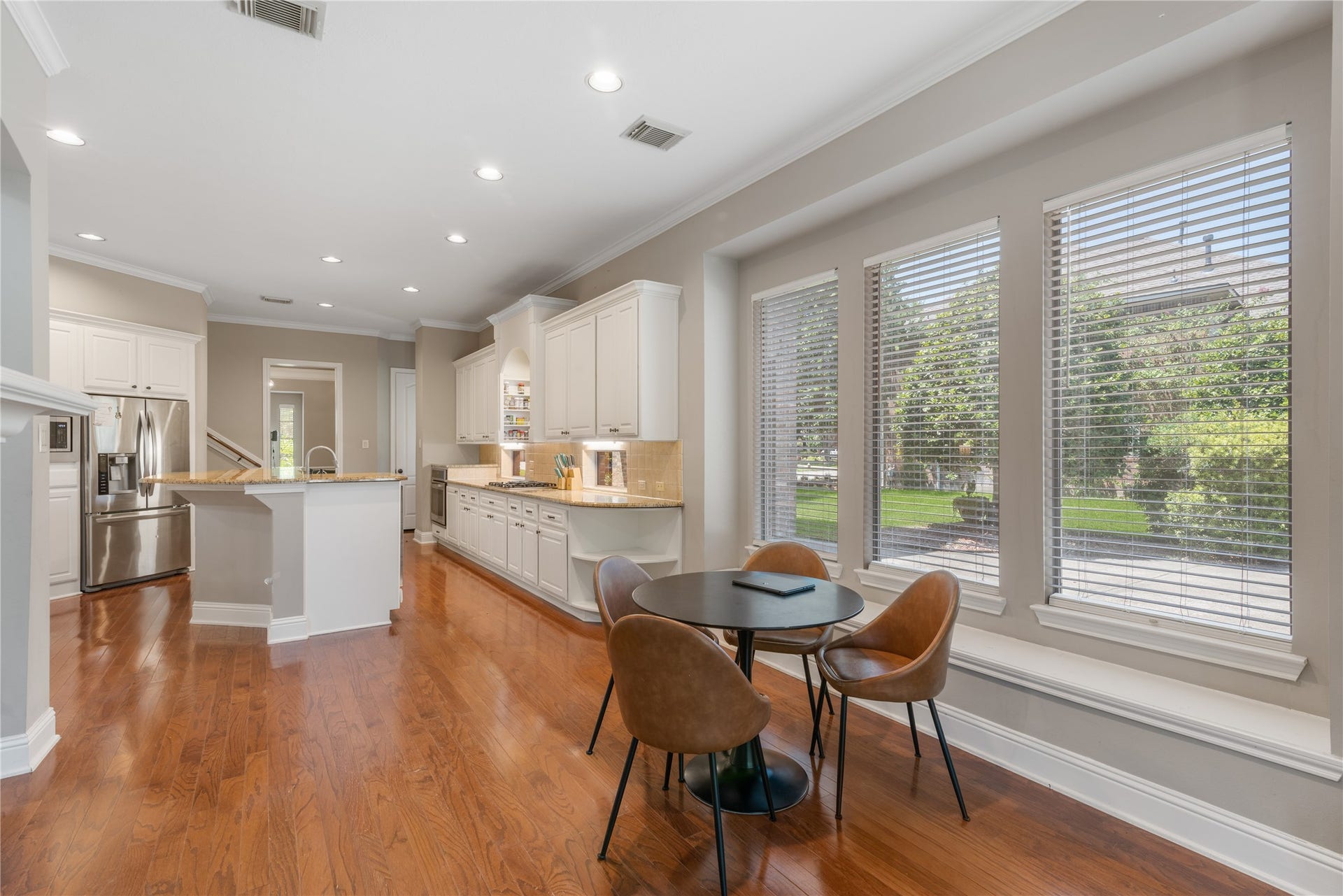 2525 W Ranch Drive, Friendswood, TX 77546 Open kitchen and a breakfast room with large windows for a bright and welcoming space.