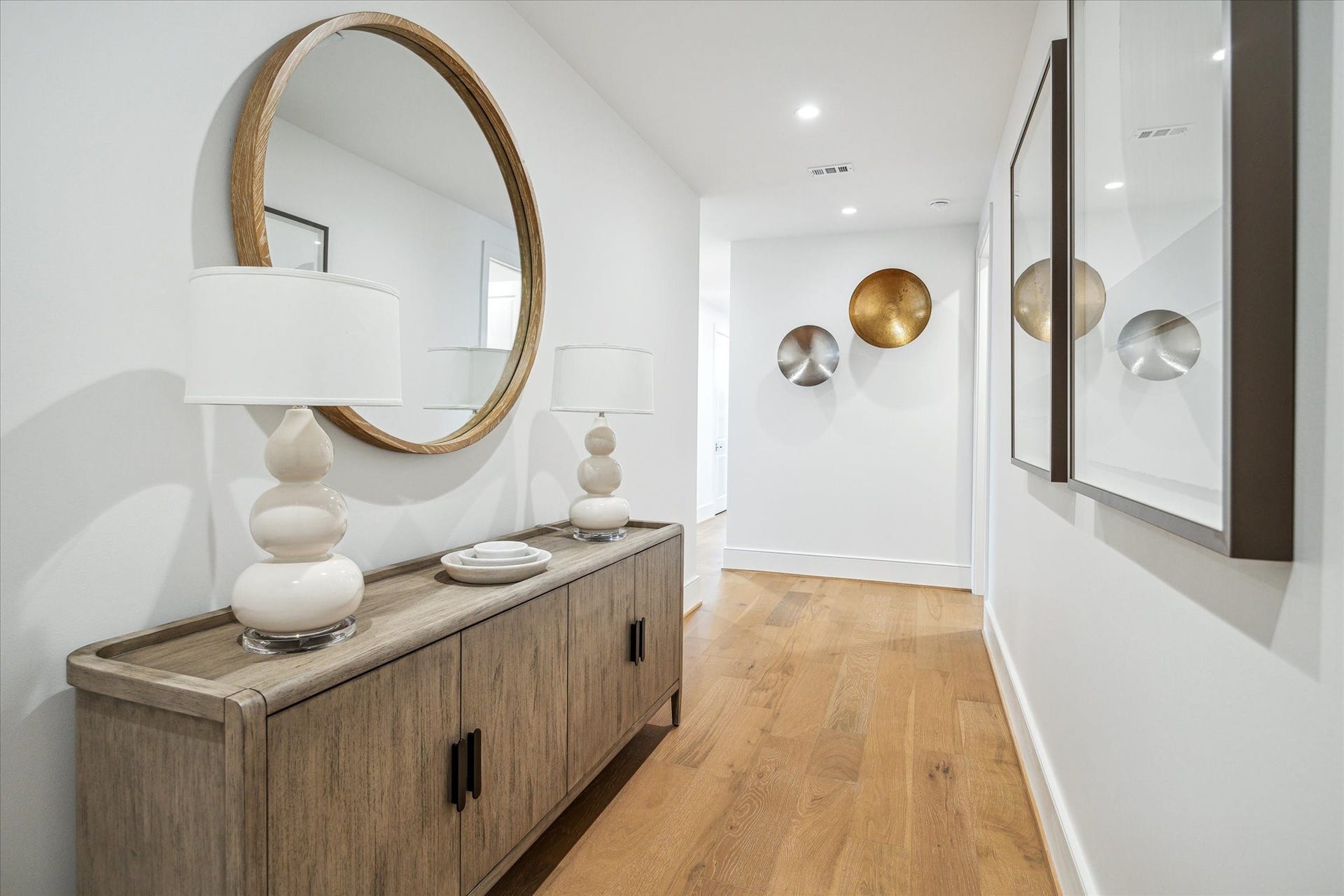 5656 San Felipe Street, #606, Houston, TX 77056 Featuring wide-plank hardwood floors and soaring ceilings, the entryway sets the tone for the homes Modern style. Photos are of a similar unit with the same floor plan