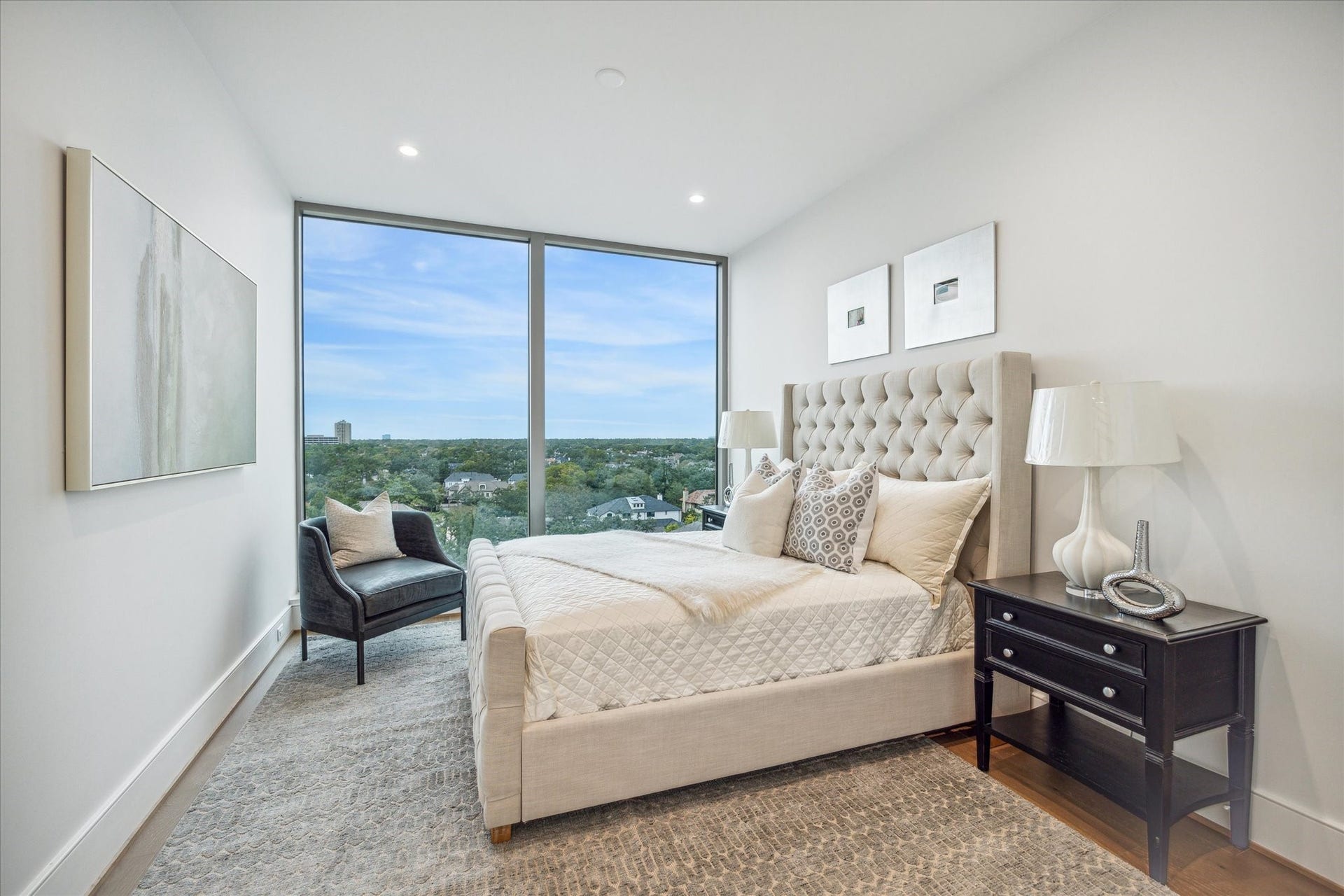5656 San Felipe Street, #606, Houston, TX 77056 Alternate view of the en-suite guest bedroom with floor-to-ceiling windows and Northern views. Photos are of a similar unit with the same floor plan