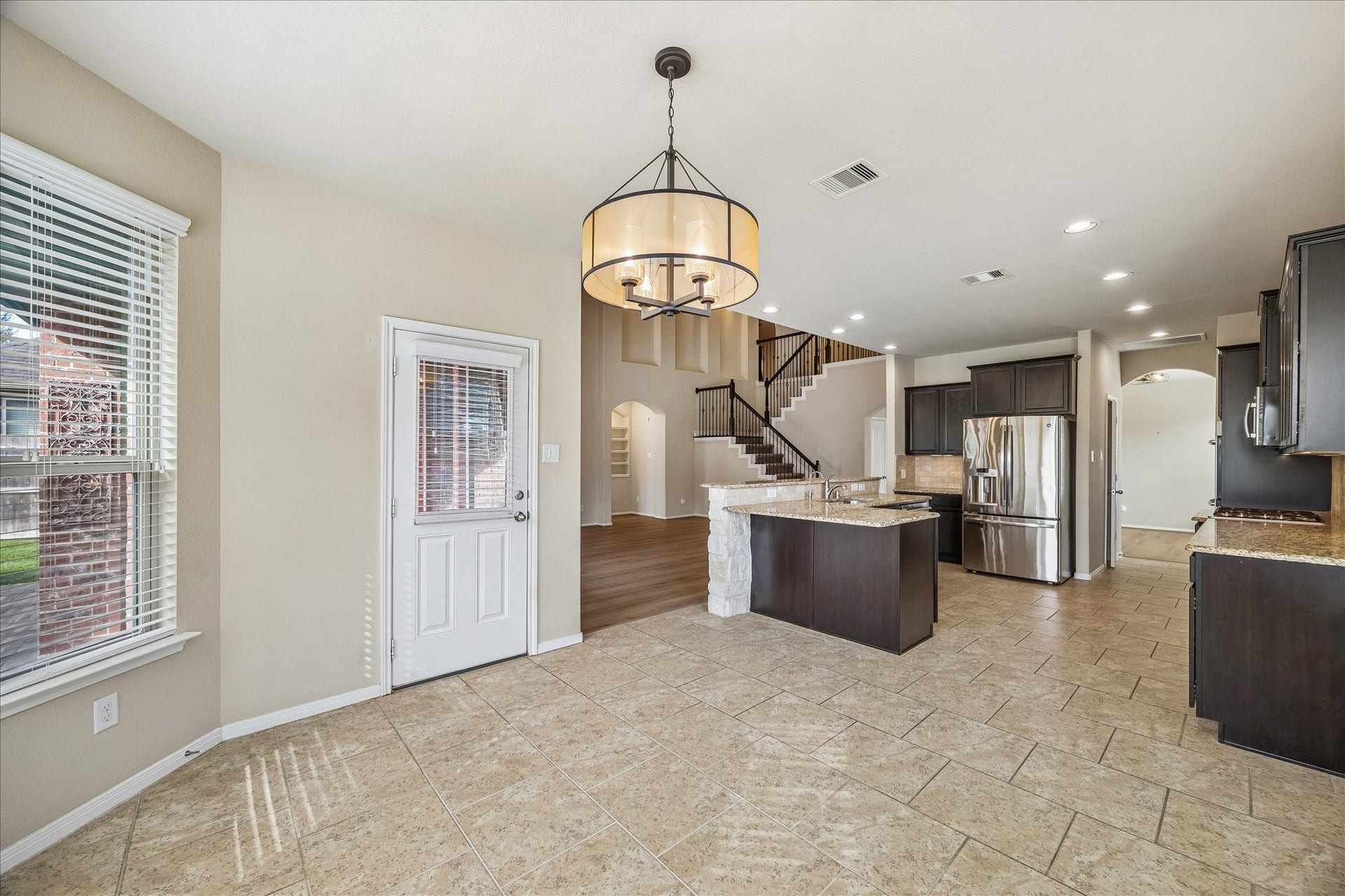 30 Glade Park Drive, Missouri City, TX 77459 Open to the kitchen and family room, this casual dining area keeps everyone connected throughout the day. Tile flooring and sunny bay windows add to the charm, while a door to the covered back patio makes dining inside or out a breeze.