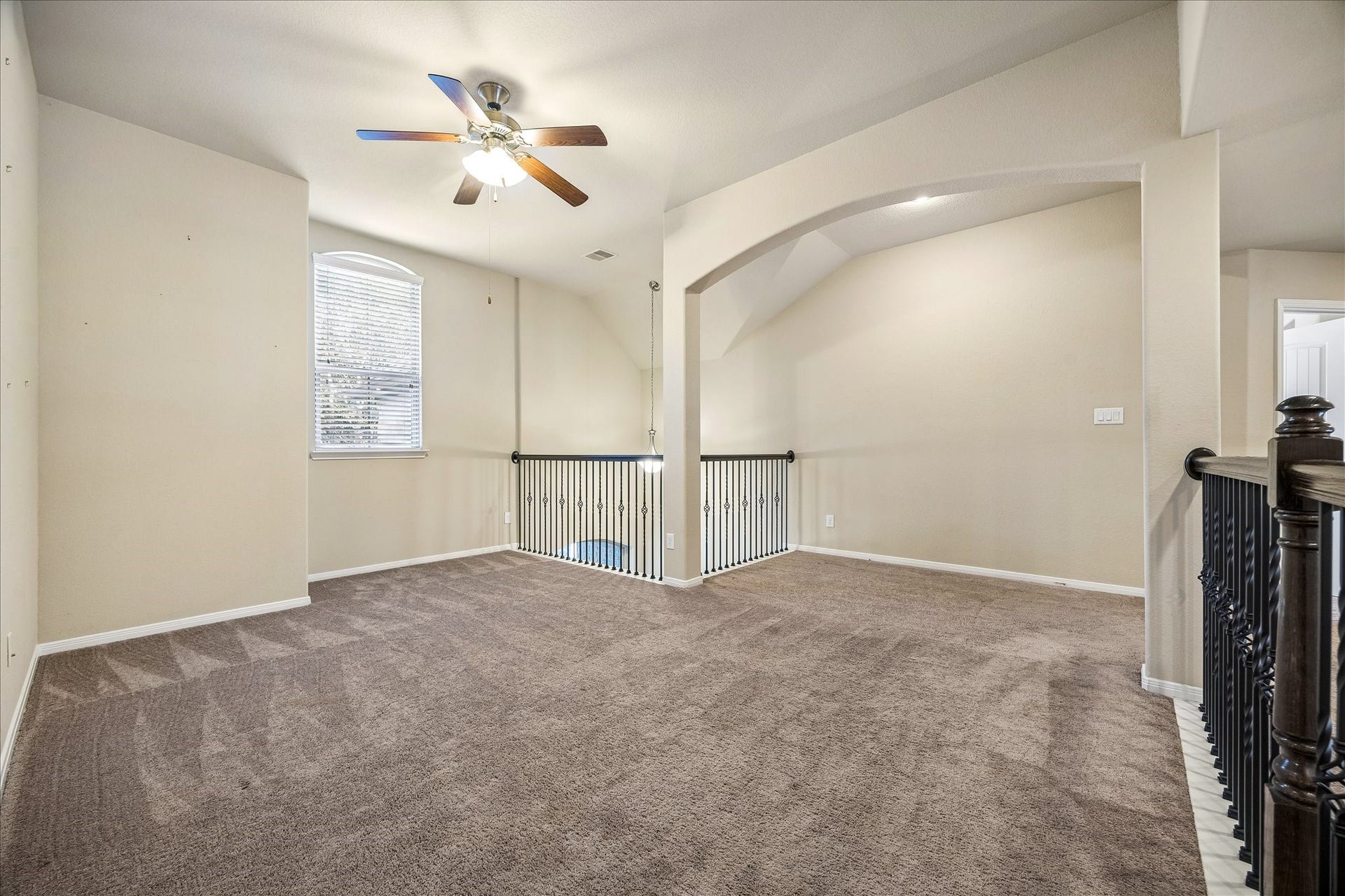 30 Glade Park Drive, Missouri City, TX 77459 Let the fun begin in this spacious upstairs game room. With plush carpeting, arched openings, and balconies overlooking the first floor, there's plenty of space for a second living area, playroom, or a place where a little mess is perfectly okay.