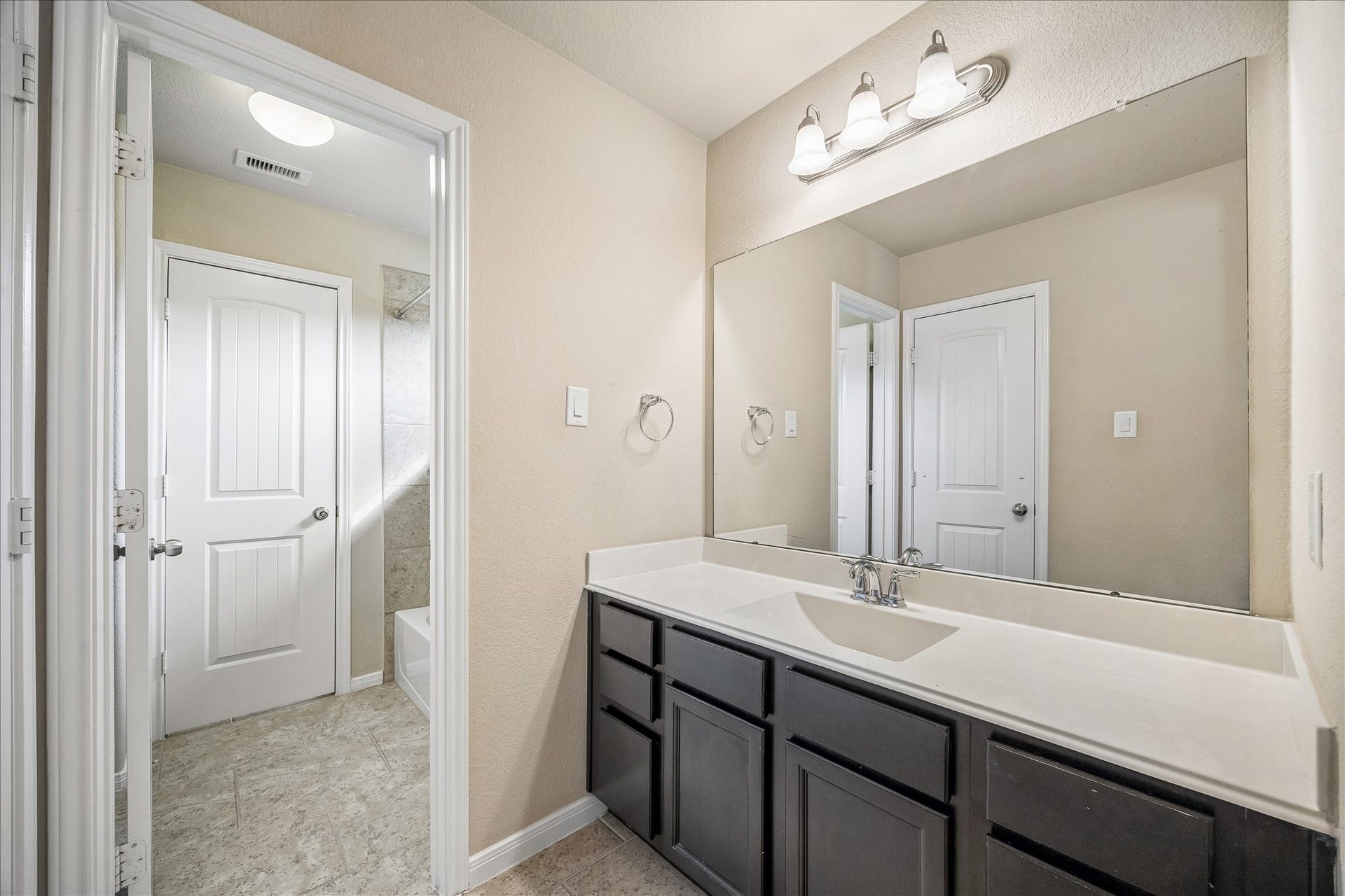 30 Glade Park Drive, Missouri City, TX 77459 Sharing a bathroom doesn't mean giving up personal space. Two guest suites enjoy their own private vanity area with a long countertop, full mirror, excellent storage, and a walk-in closet.