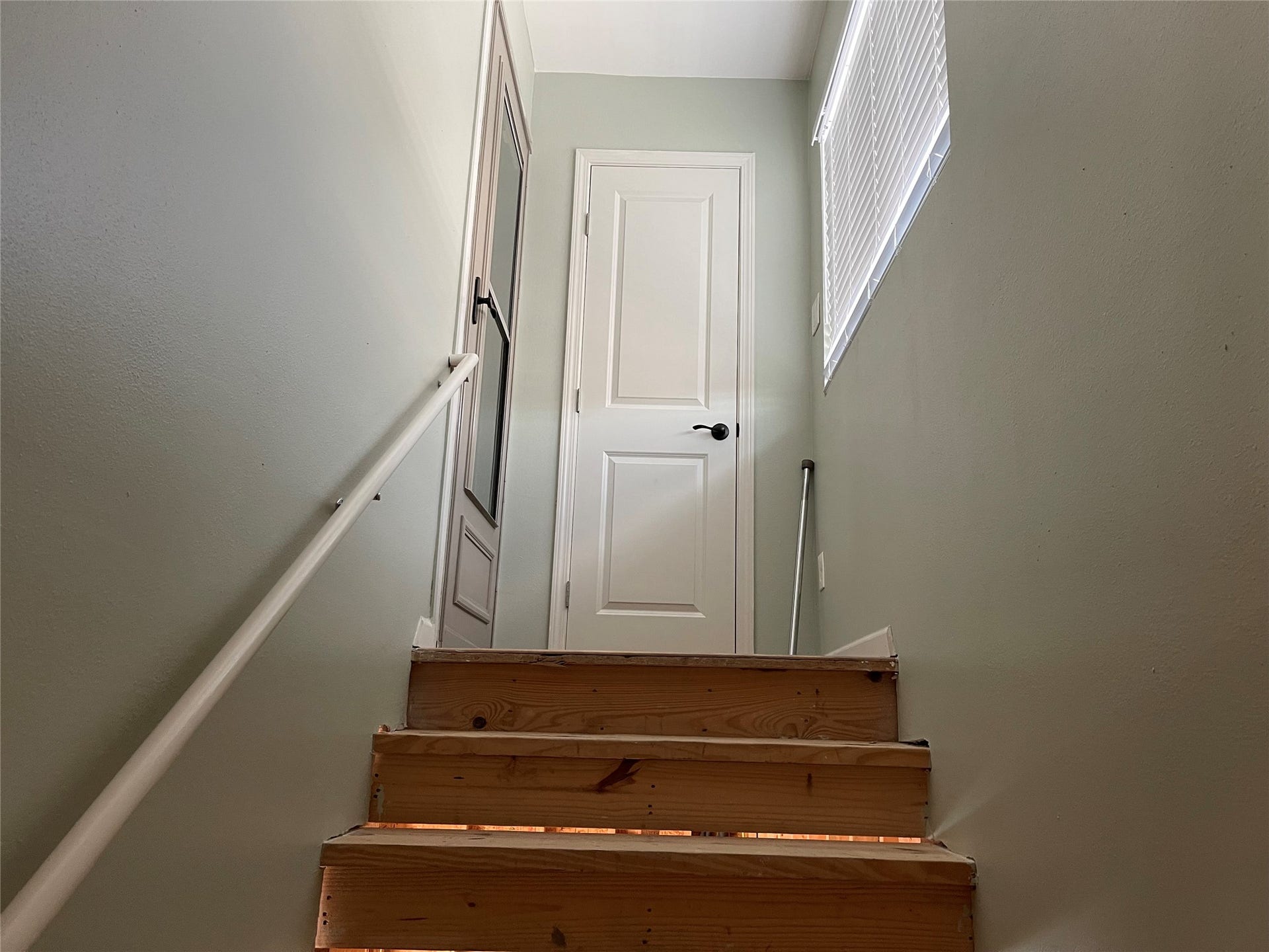 6535 Bastrop Trail, Manvel, TX 77578 Stairs to the game room in garage