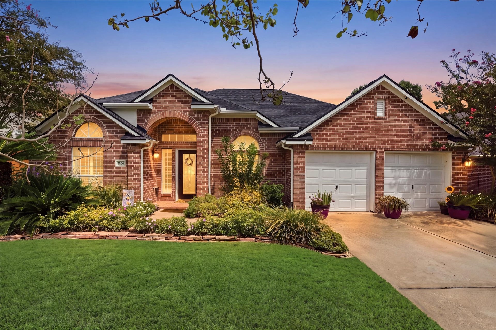 Charming brick home with inviting curb appeal and two-car garage