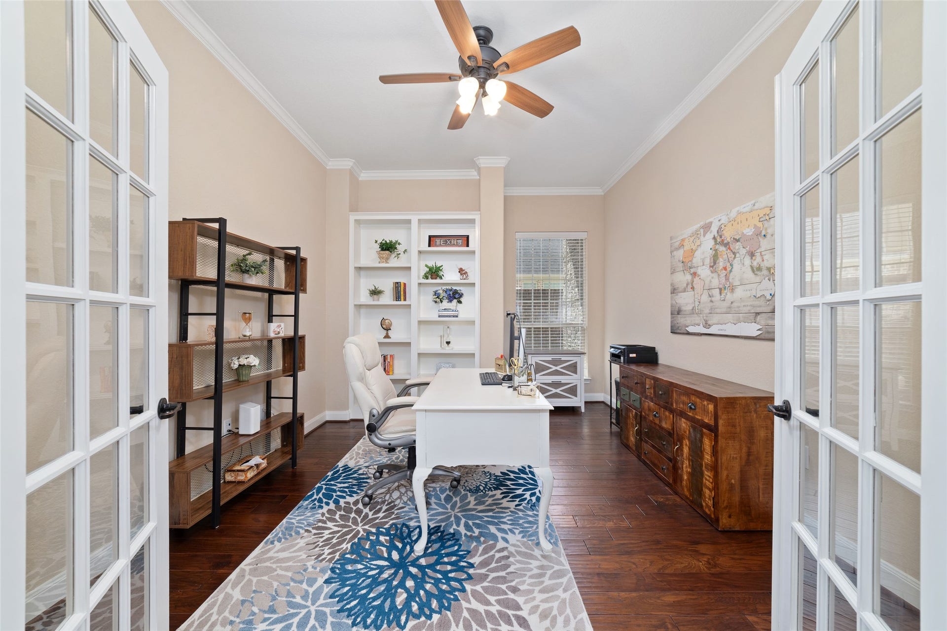 9234 E Canyon Lake Springs Drive, Cypress, TX 77433 Home office/study just off the dining room with beautiful doors that bring in natural light and privacy. Built in shelving for displaying and storage.