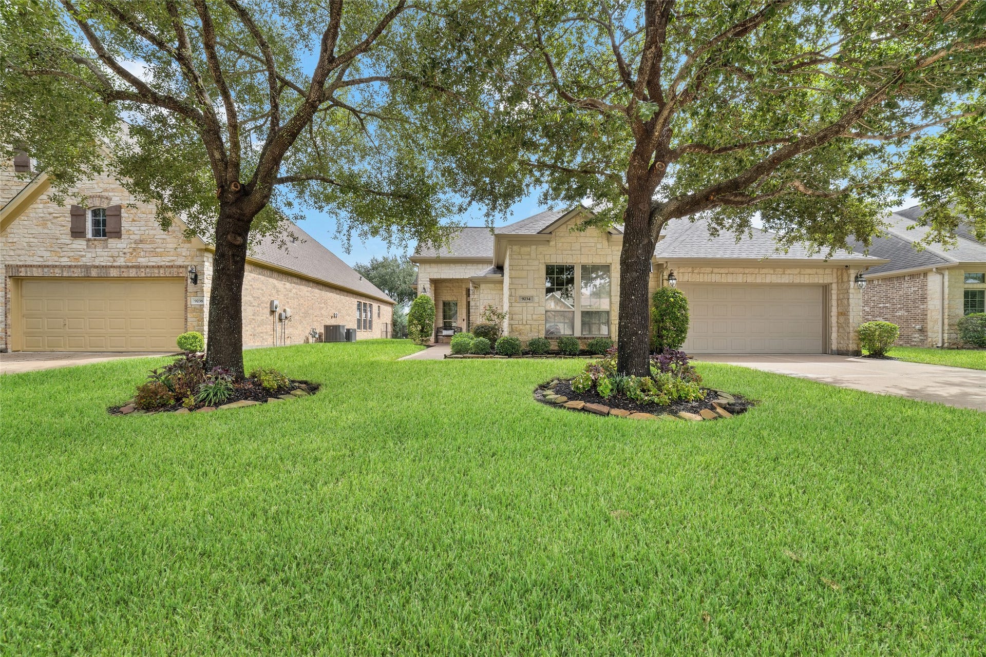 9234 E Canyon Lake Springs Drive, Cypress, TX 77433 The curb appeal is gorgeous! Beautiful oak trees, stone elevation and a welcoming entry.