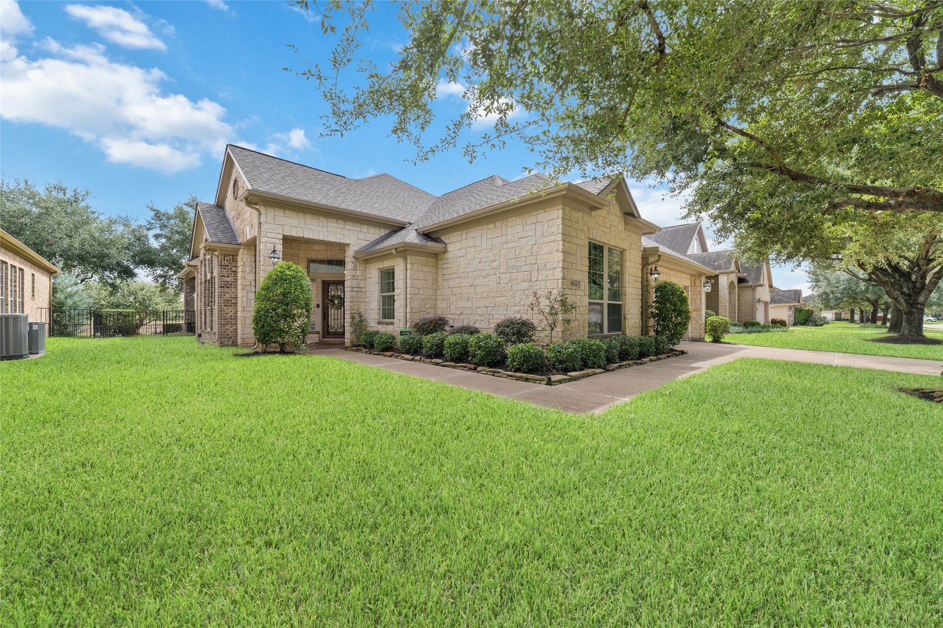 9234 E Canyon Lake Springs Drive, Cypress, TX 77433 The stone and brick elevation sets the tone for a home filled with warmth, character, and charm.