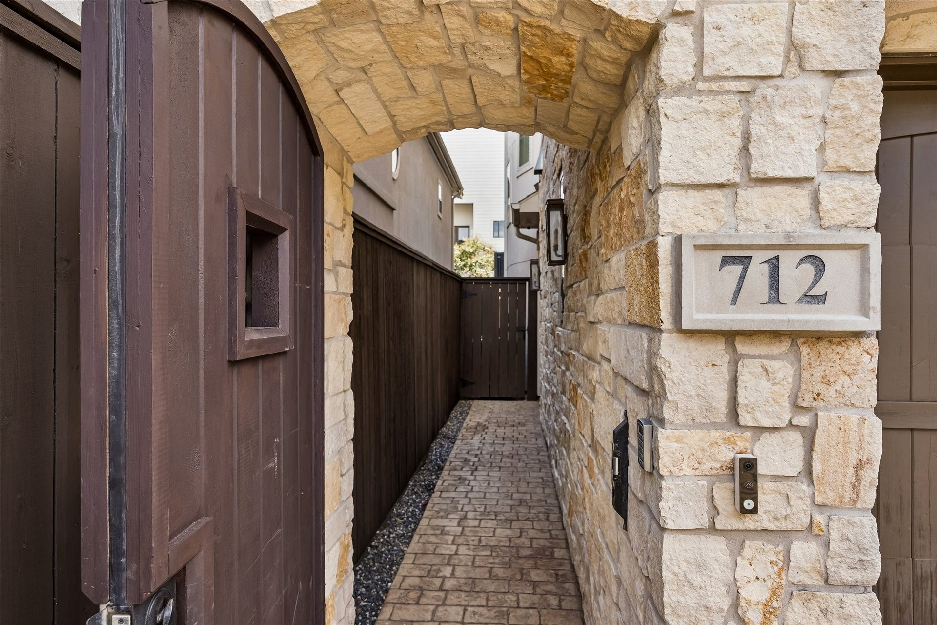 Ring the doorbell at the locked entrance.