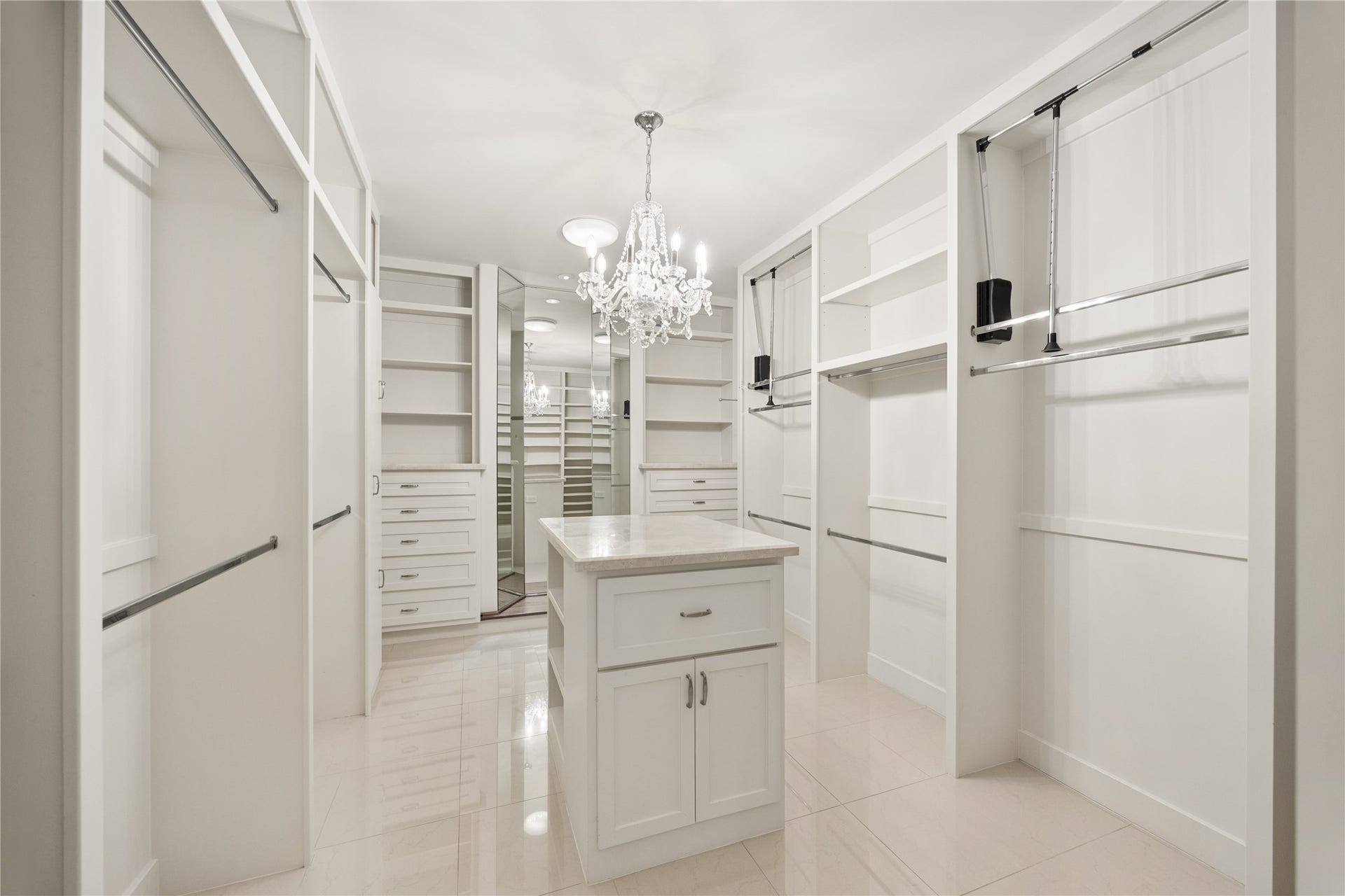 Expansive primary closet with island for packing and storage