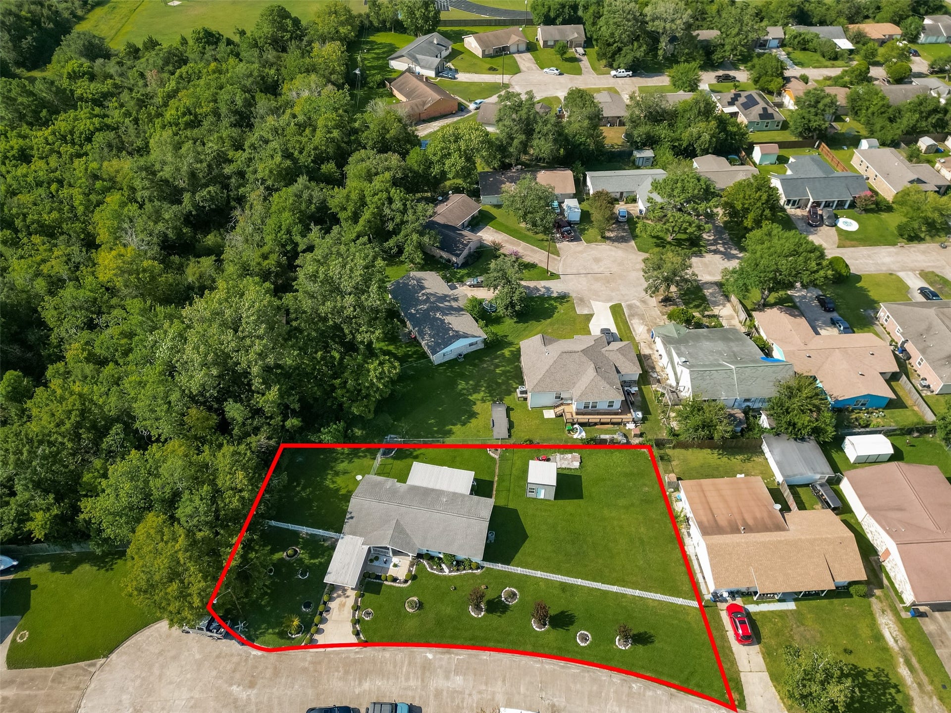 7502 Nightingale Circle, Texas City, TX 77591 Bird's-eye view highlights the generous lot size, beautifully maintained grounds, and prime location on a quiet cul-de-sac.
For illustration purposes only, the property has been outlined in red to provide a general representation of the lot. Buyers are encouraged to verify property boundaries and dimensions independently.