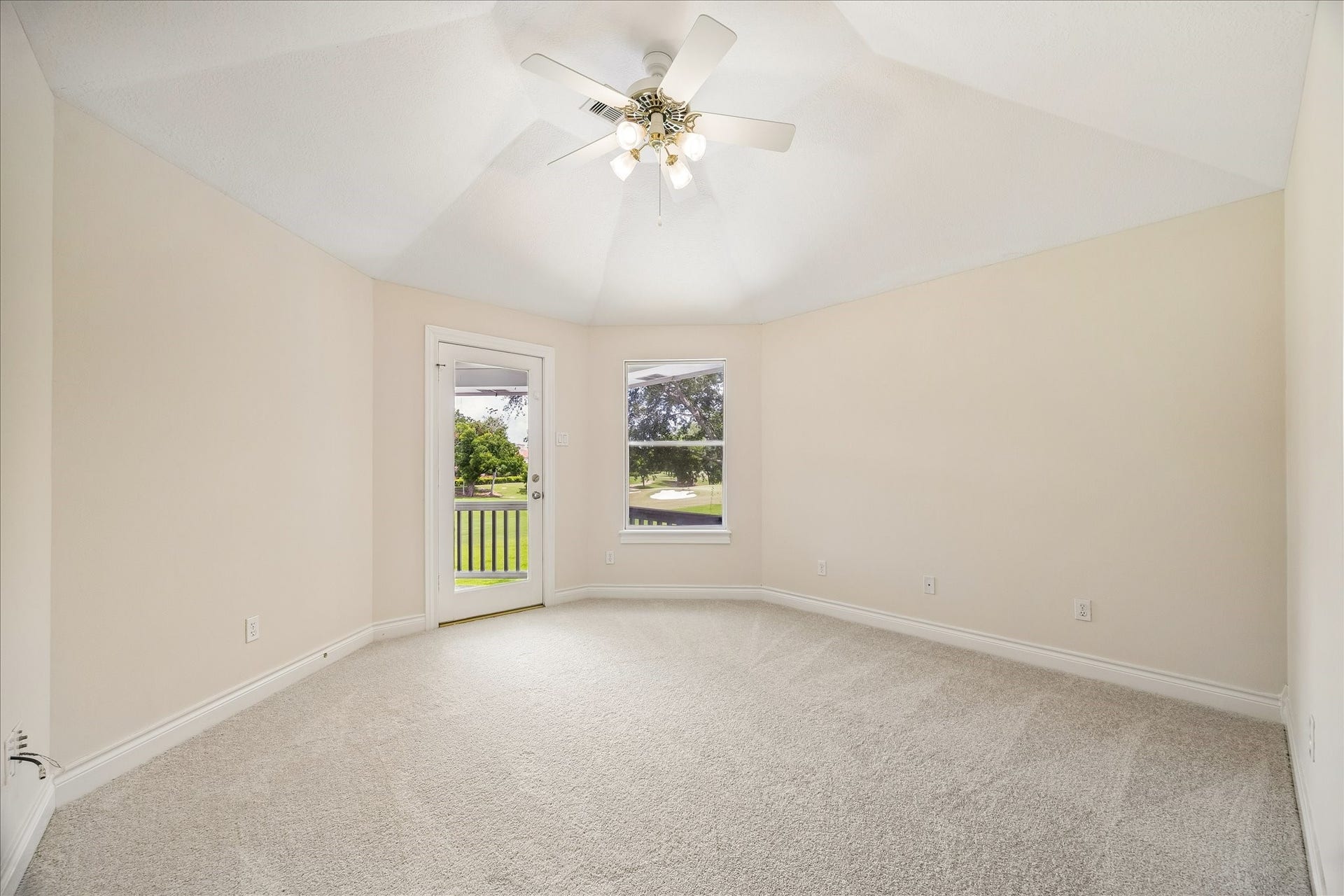 3319 Oakland Drive, Sugar Land, TX 77479 The raised en-suite guest bedroom has access to the covered balcony deck and overlooks the pool and golf course.