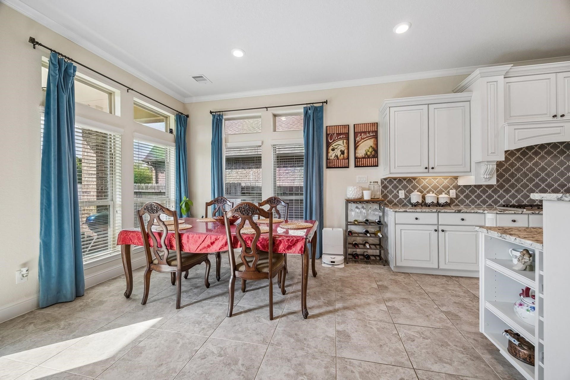 6031 Granite Shadow Lane, Porter, TX 77365 Breakfast area situated in open area to kitchen and living room.